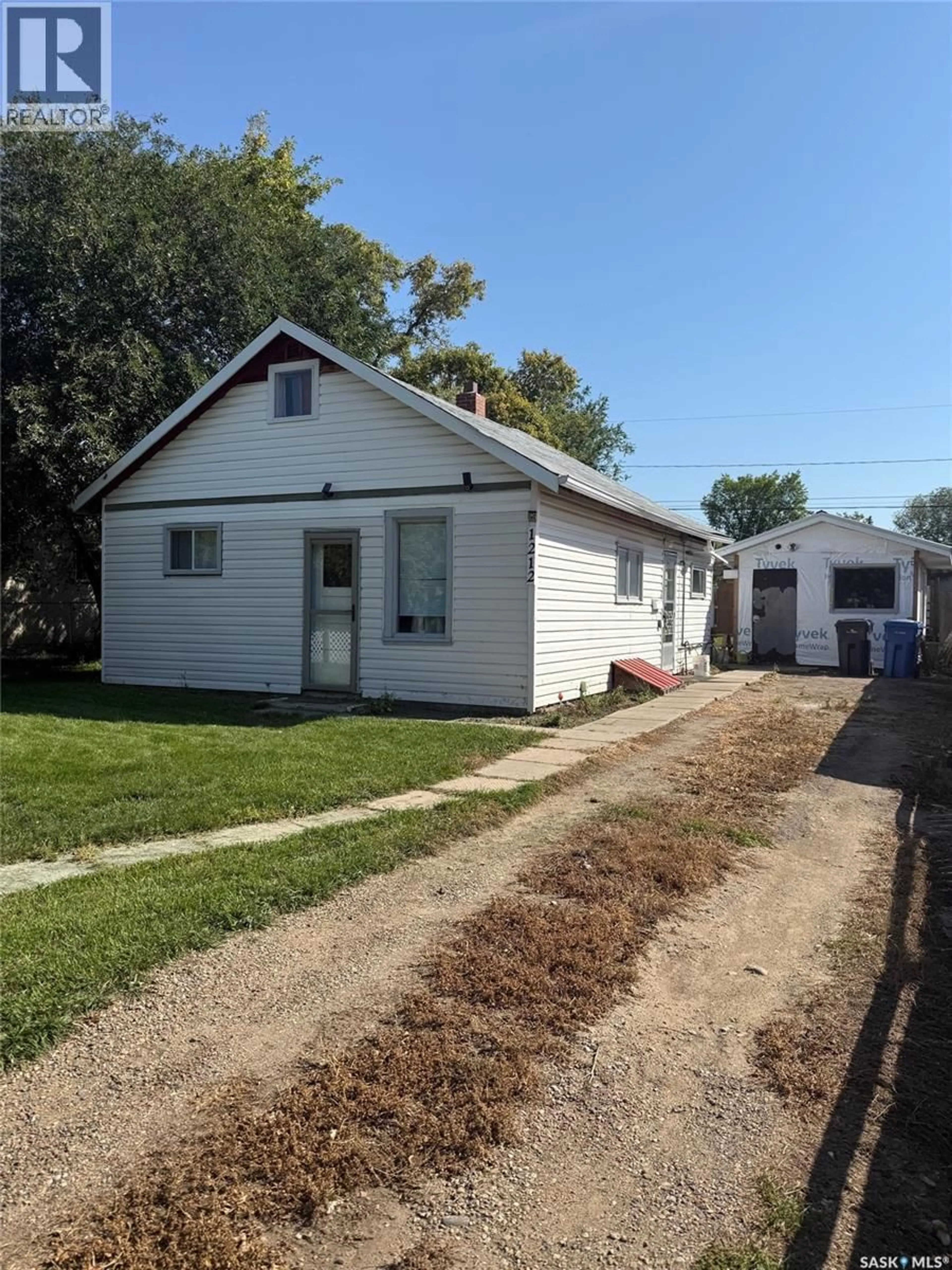 Home with vinyl exterior material, street for 1212 108TH STREET, North Battleford Saskatchewan S9A2B2