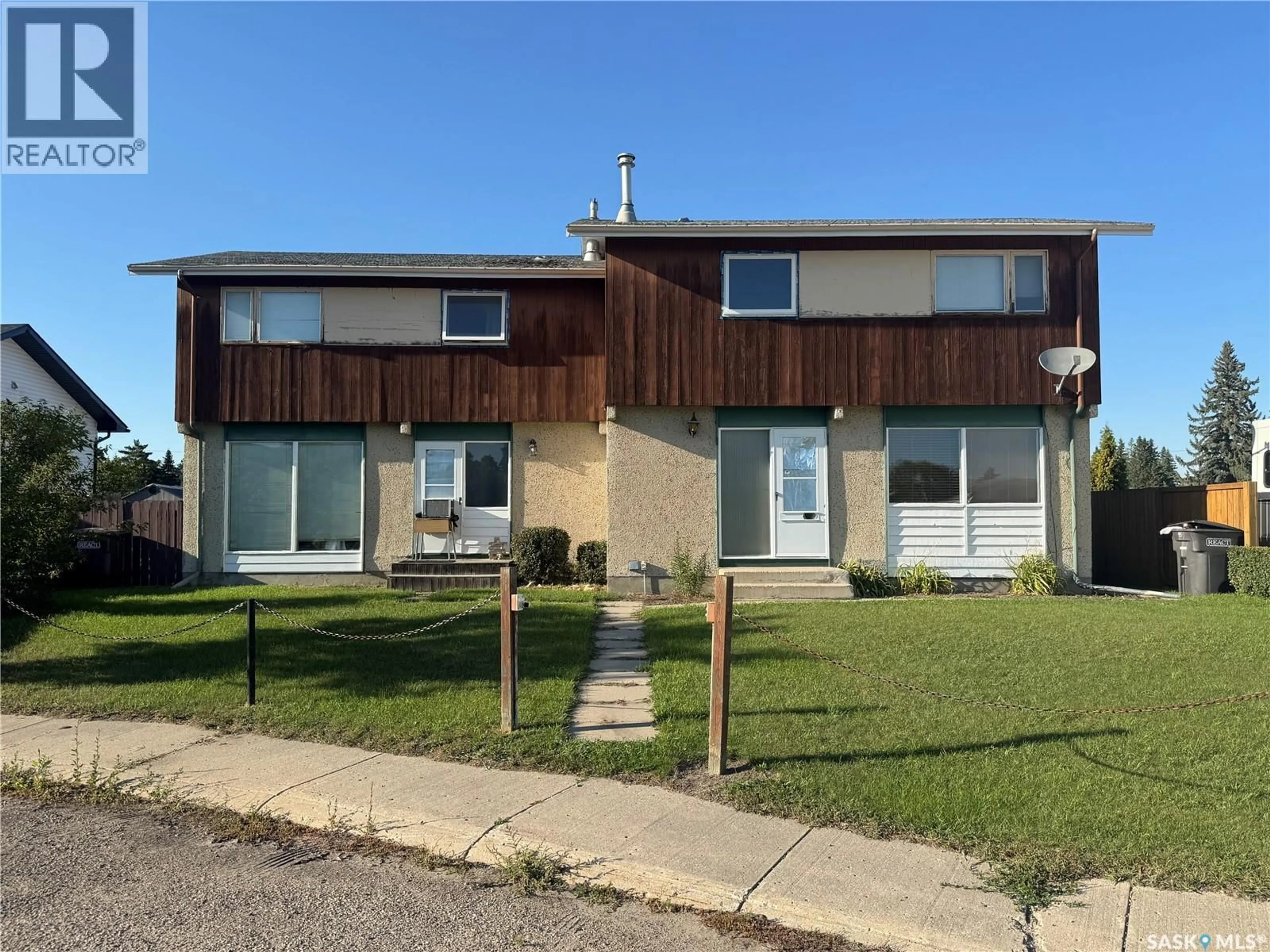 Home with vinyl exterior material, street for 9A & 9B MAPLE PLACE, Lanigan Saskatchewan S0K2M0