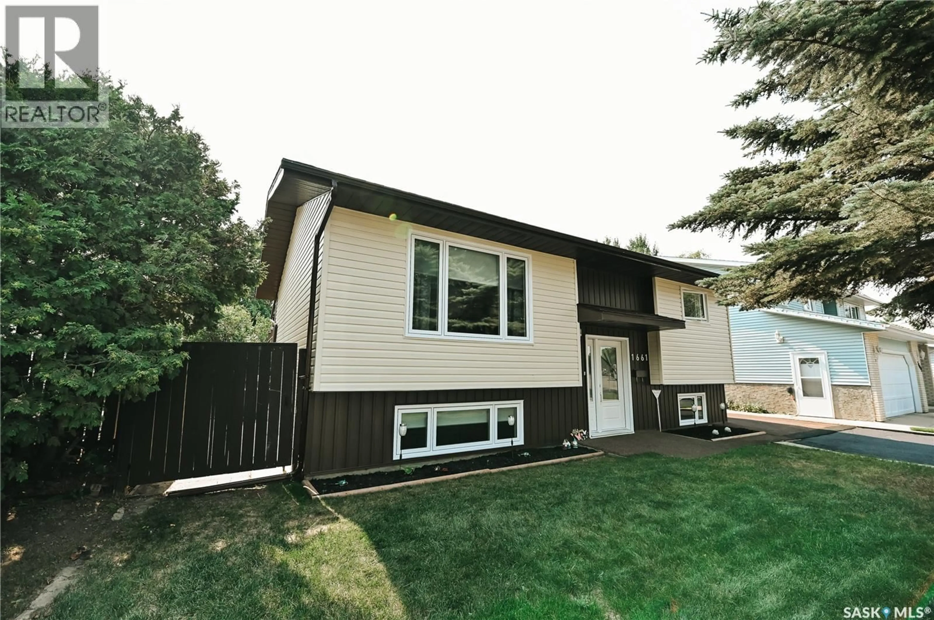 Home with vinyl exterior material, street for 1661 OLIVE DIEFENBAKER DRIVE, Prince Albert Saskatchewan S6V7V9