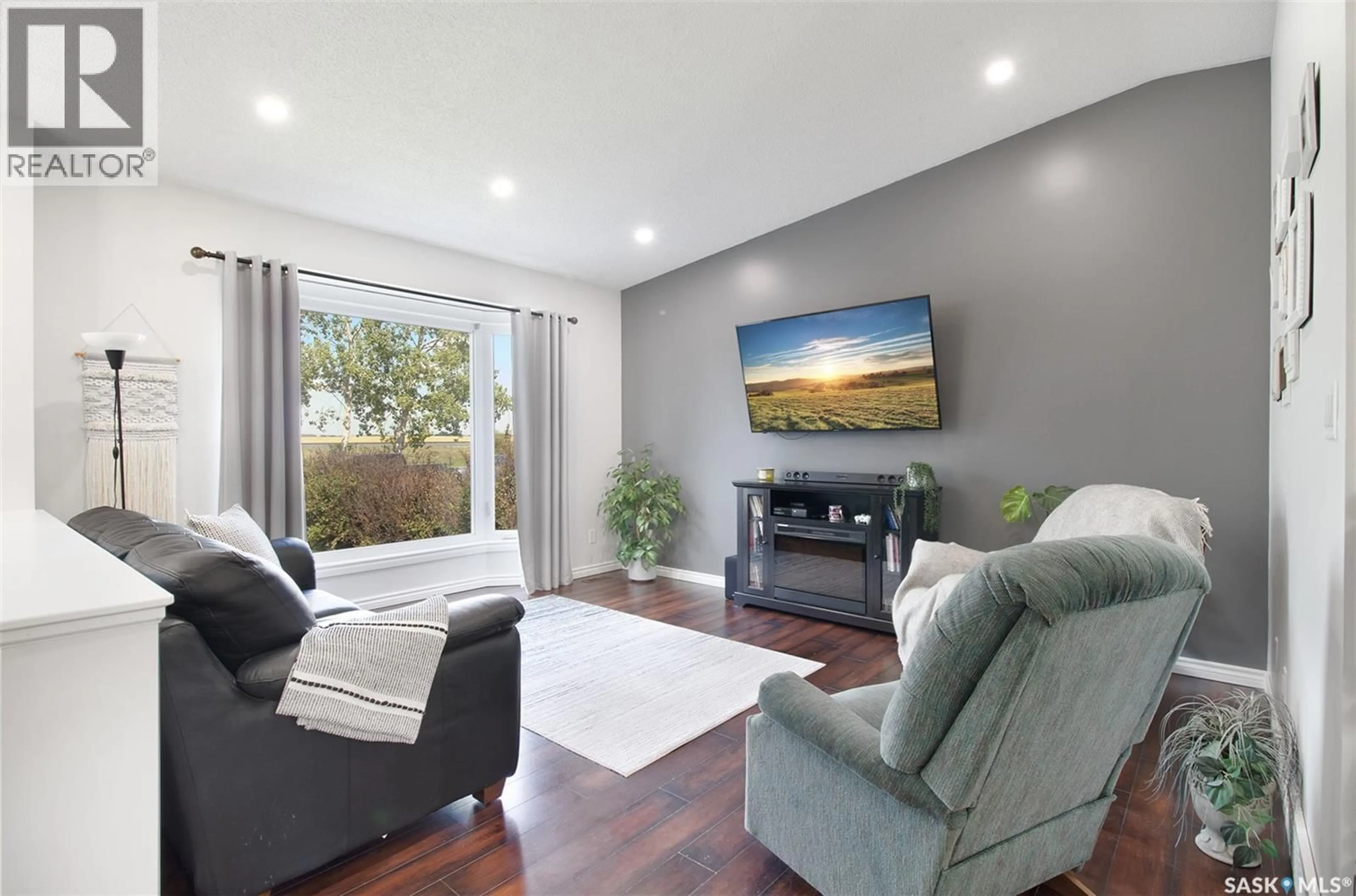 Living room with furniture, wood/laminate floor for 607 RAILWAY STREET, Balgonie Saskatchewan S0G0E0