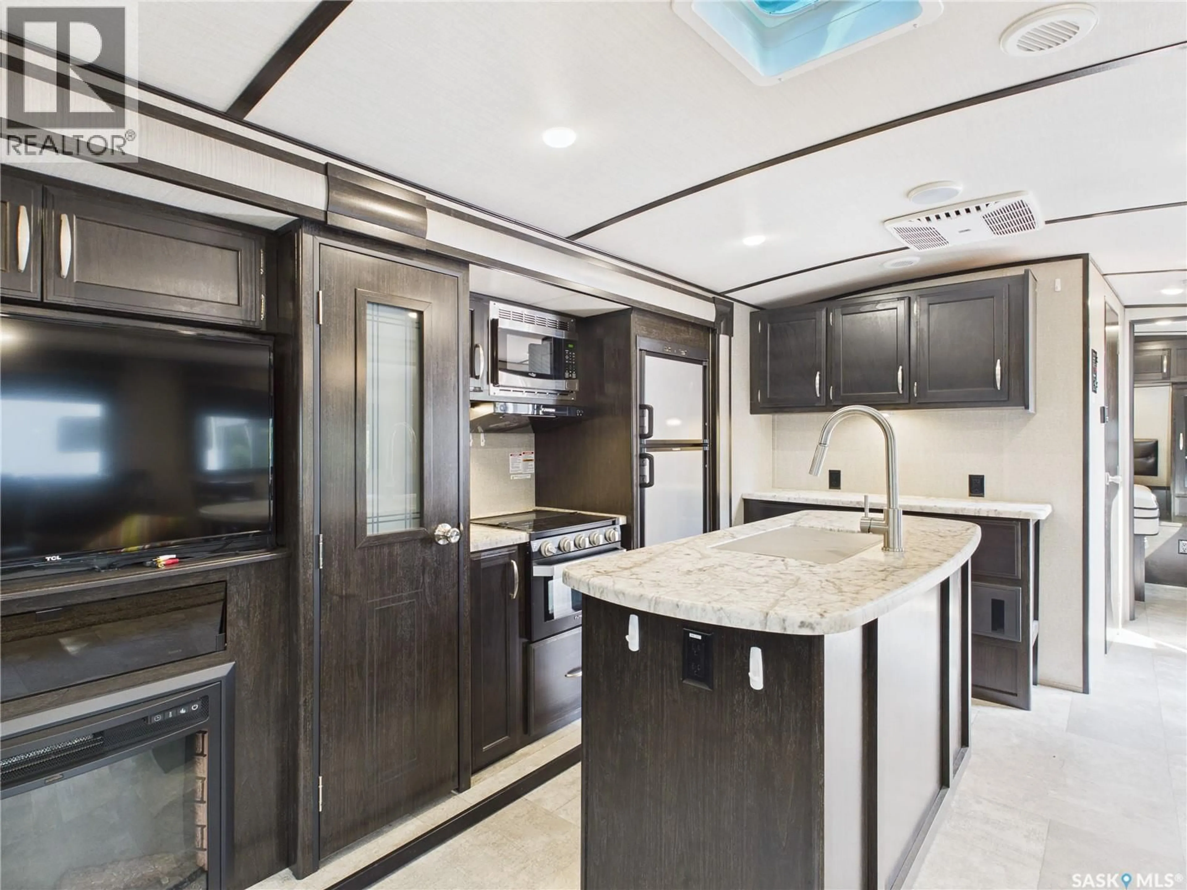 Open concept kitchen, ceramic/tile floor for 408 OWL STREET, Candle Lake Saskatchewan S0J3E0