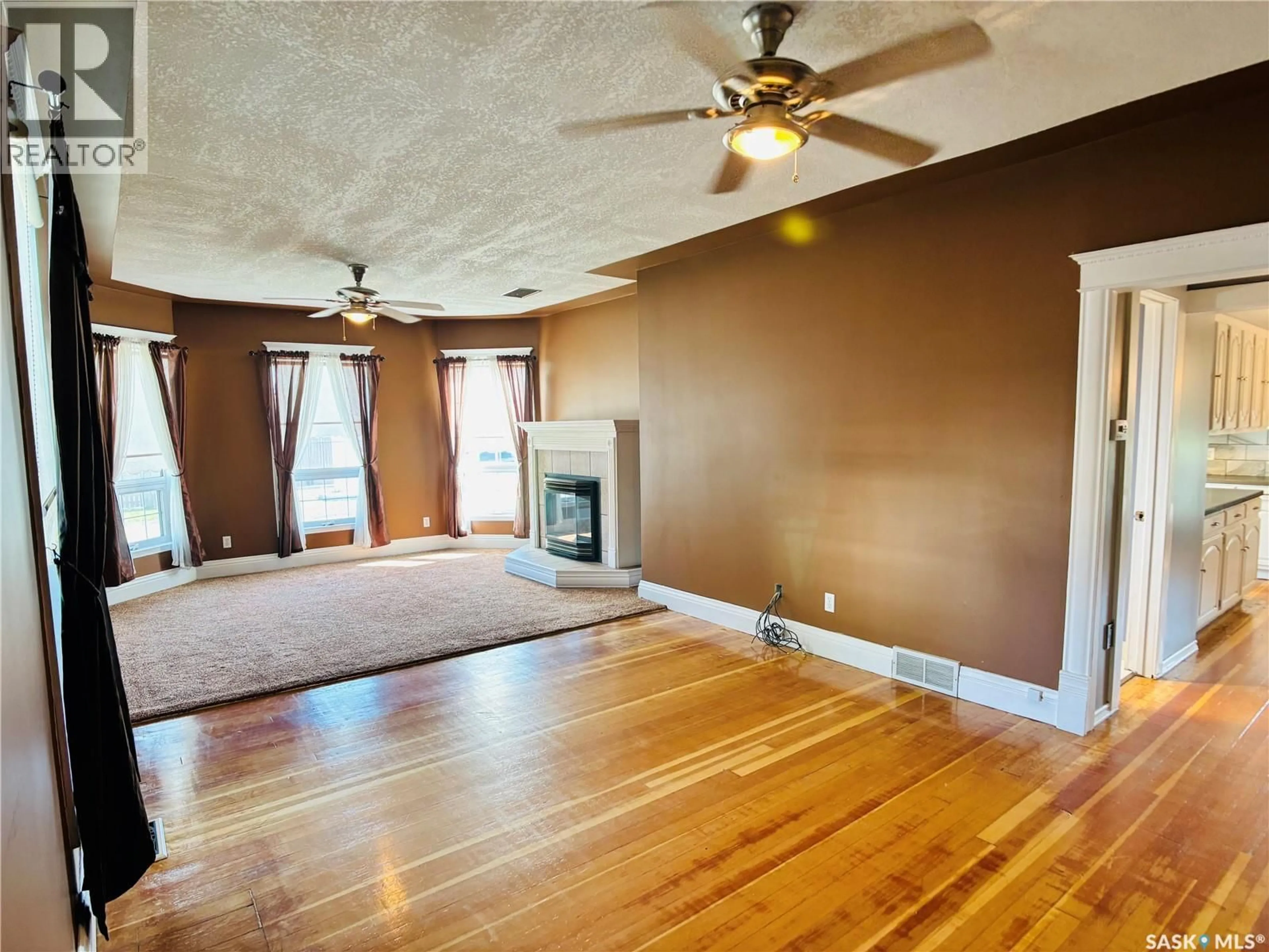 Living room with furniture, wood/laminate floor for 520 1ST STREET, North Portal Saskatchewan S0C1W0