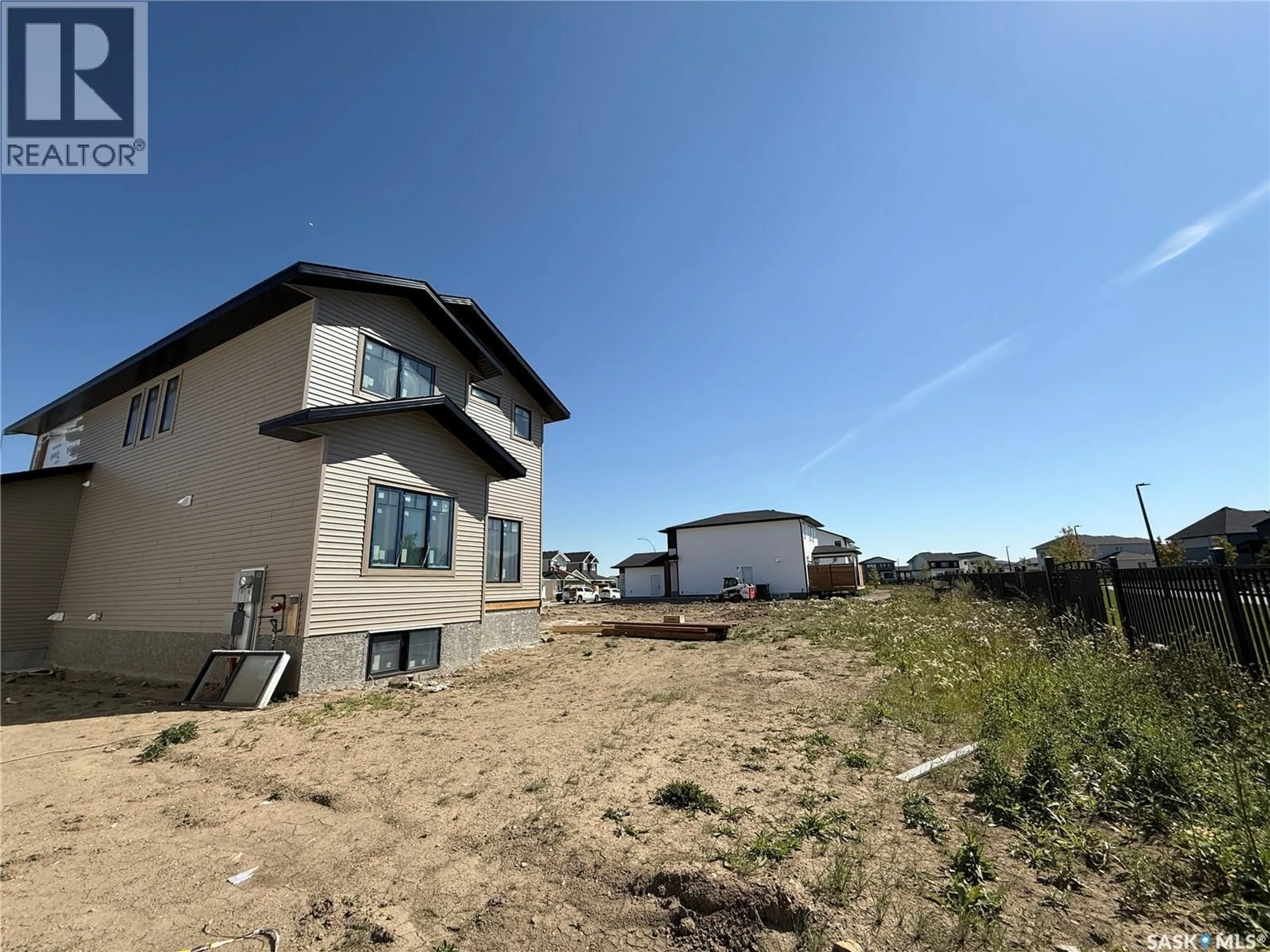 A pic from outside/outdoor area/front of a property/back of a property/a pic from drone, unknown for 146 HAVERSTOCK CRESCENT, Saskatoon Saskatchewan S7W1E2