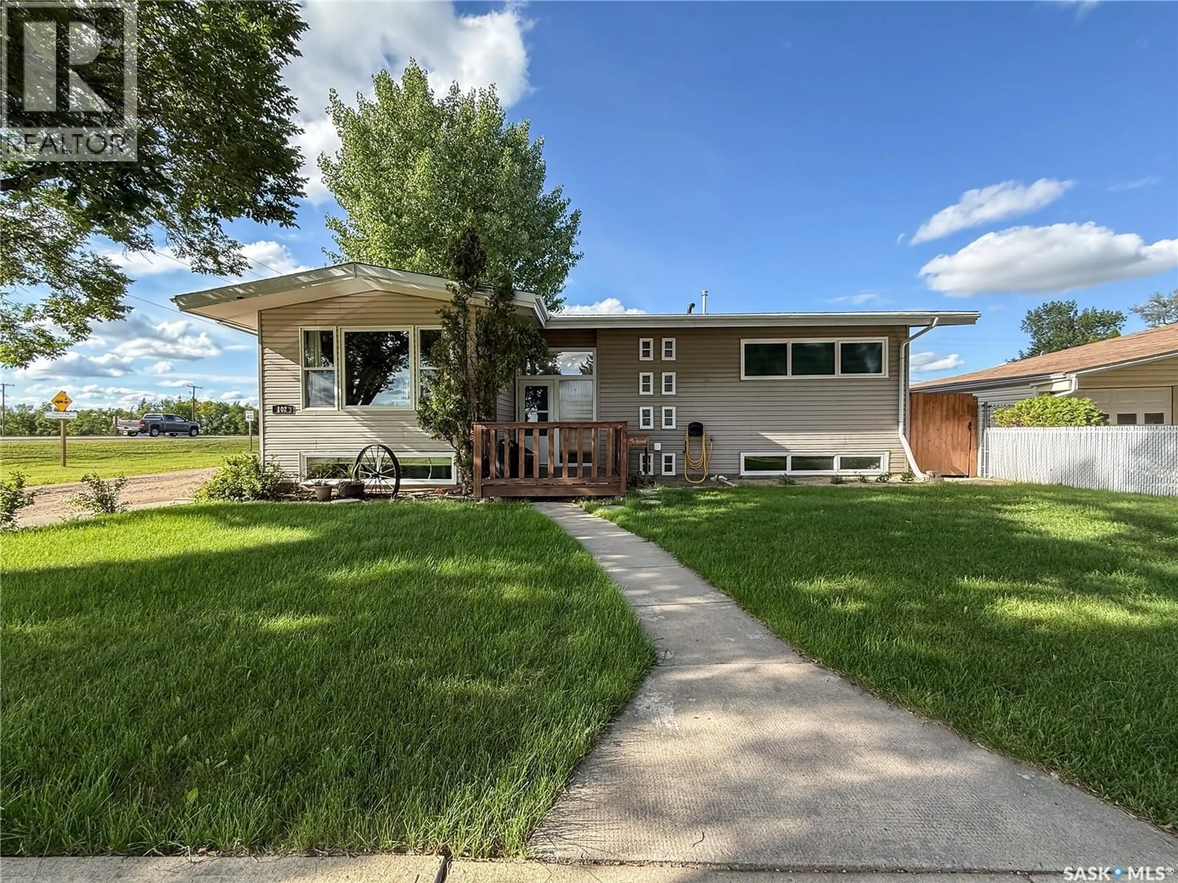 Home with vinyl exterior material, street for 102 CLAUSTRE AVENUE, Maple Creek Saskatchewan S0N1N0