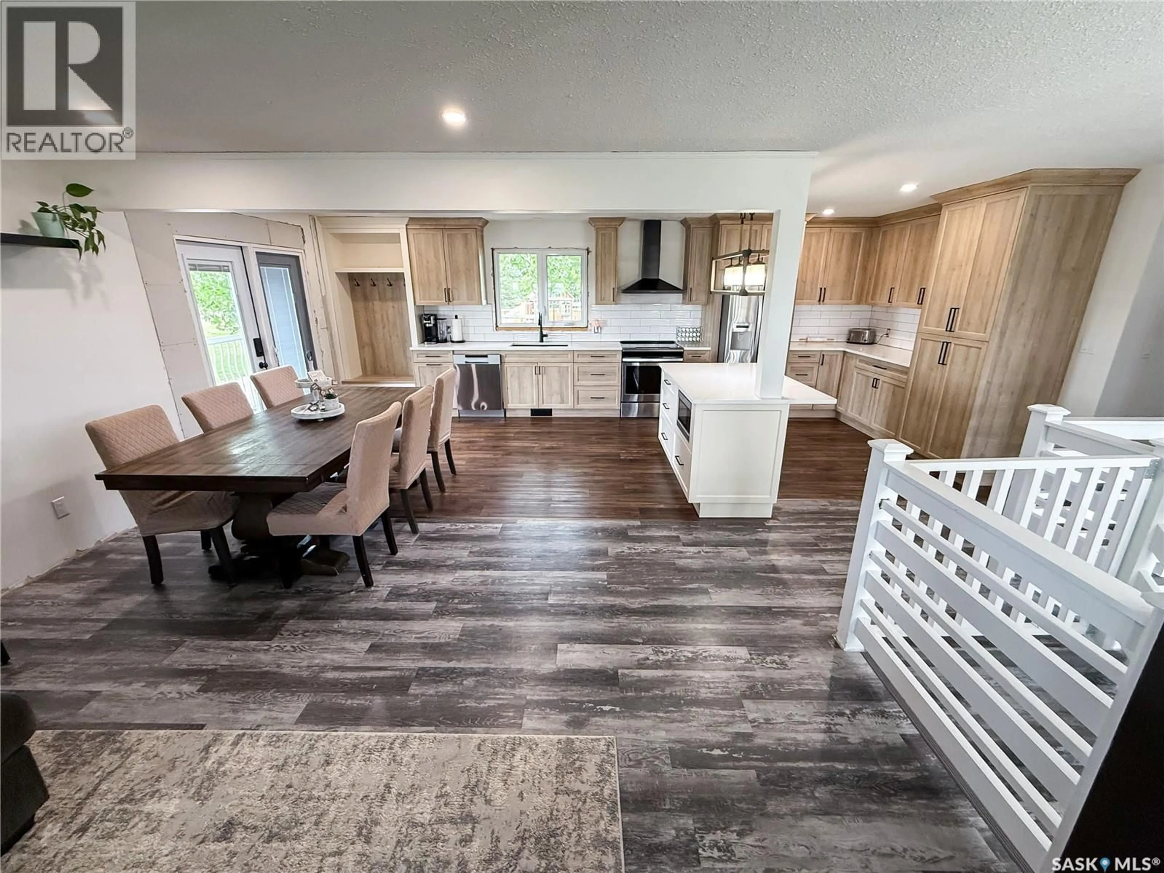Open concept kitchen, wood/laminate floor for 102 CLAUSTRE AVENUE, Maple Creek Saskatchewan S0N1N0