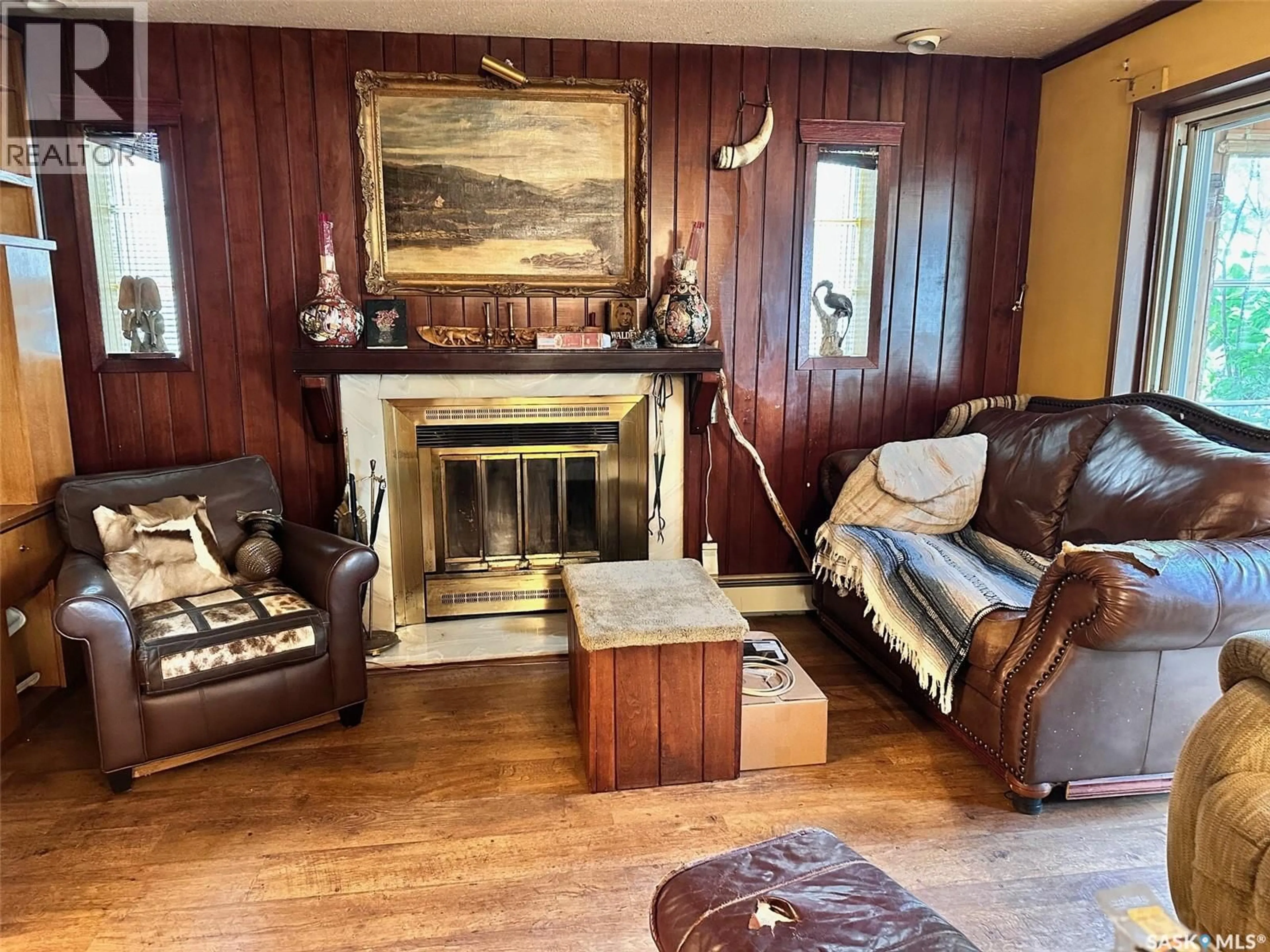 Living room with furniture, wood/laminate floor for 209 5TH AVENUE, Spiritwood Saskatchewan S0J2M0