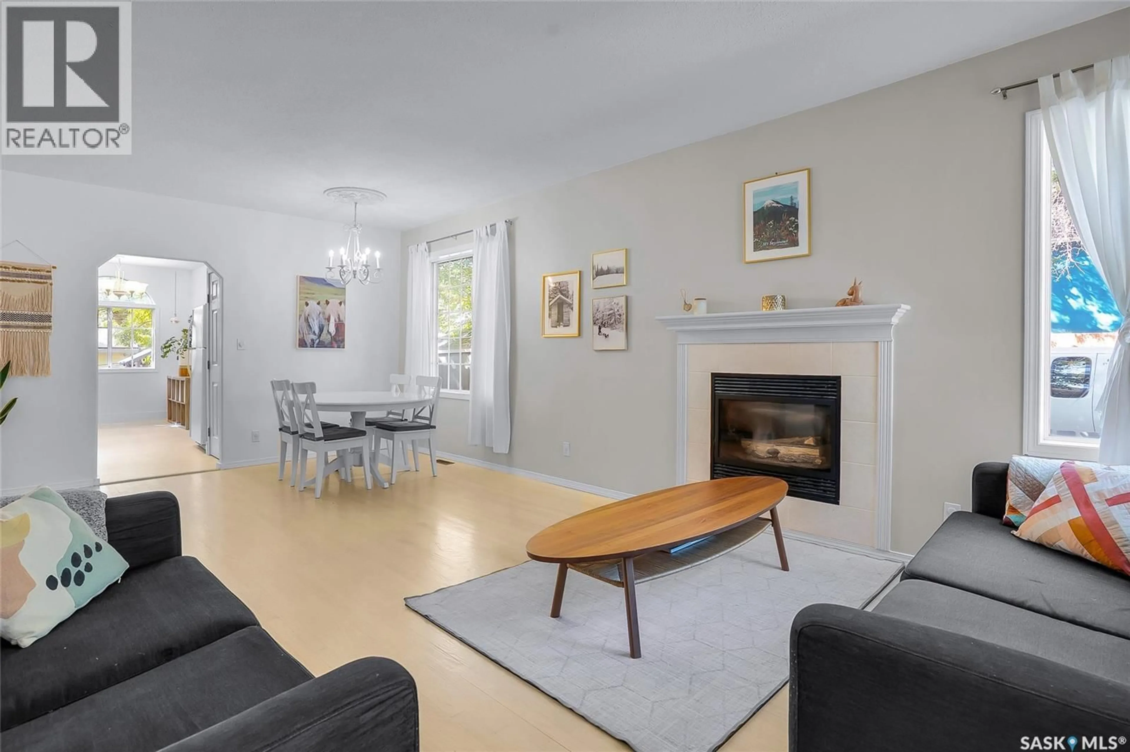 Living room with furniture, wood/laminate floor for 119 28TH STREET, Saskatoon Saskatchewan S7L0K1