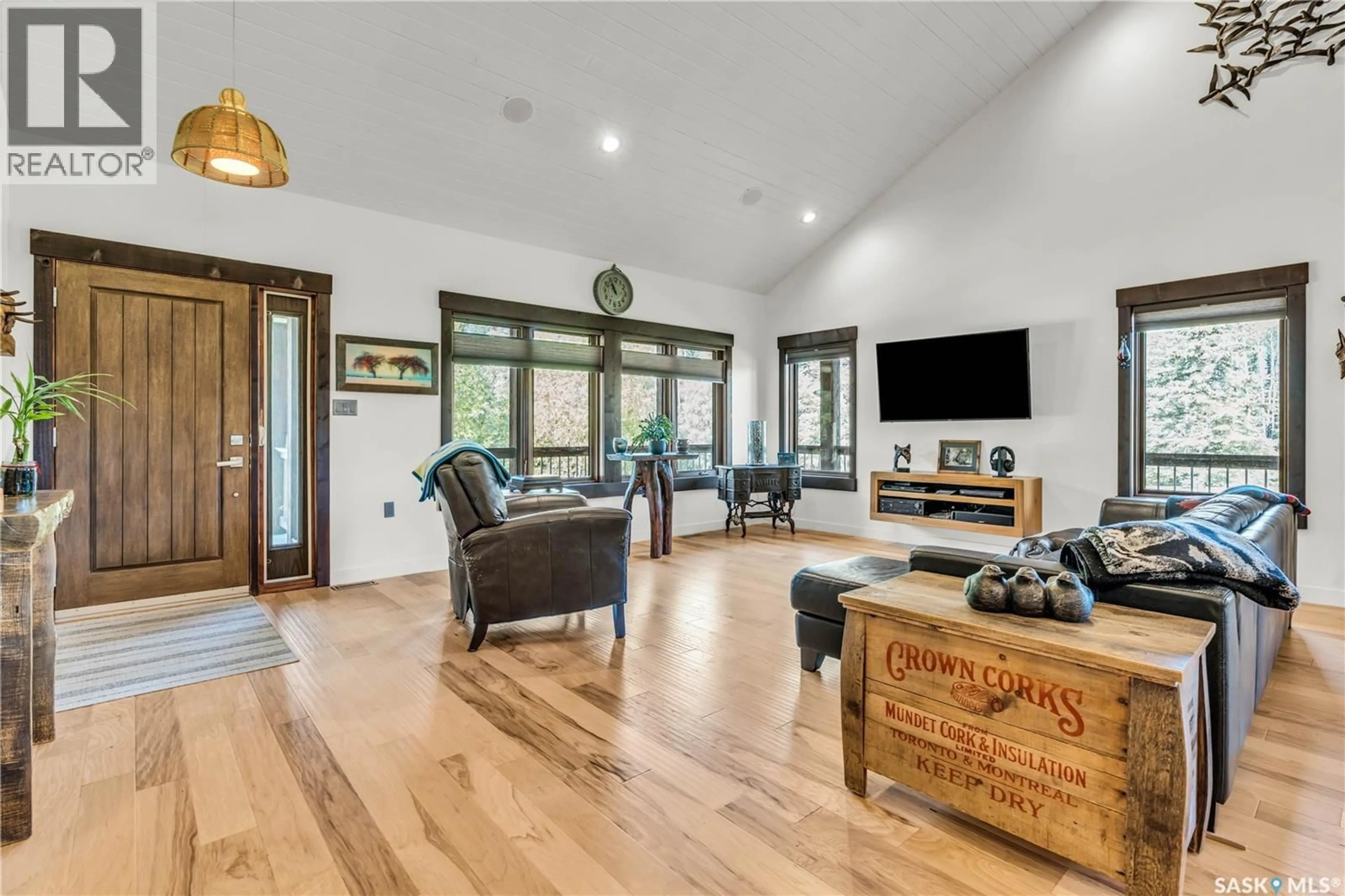 Living room with furniture, wood/laminate floor for 303 MEADOW RIDGE DRIVE, Candle Lake Saskatchewan S0J3E0