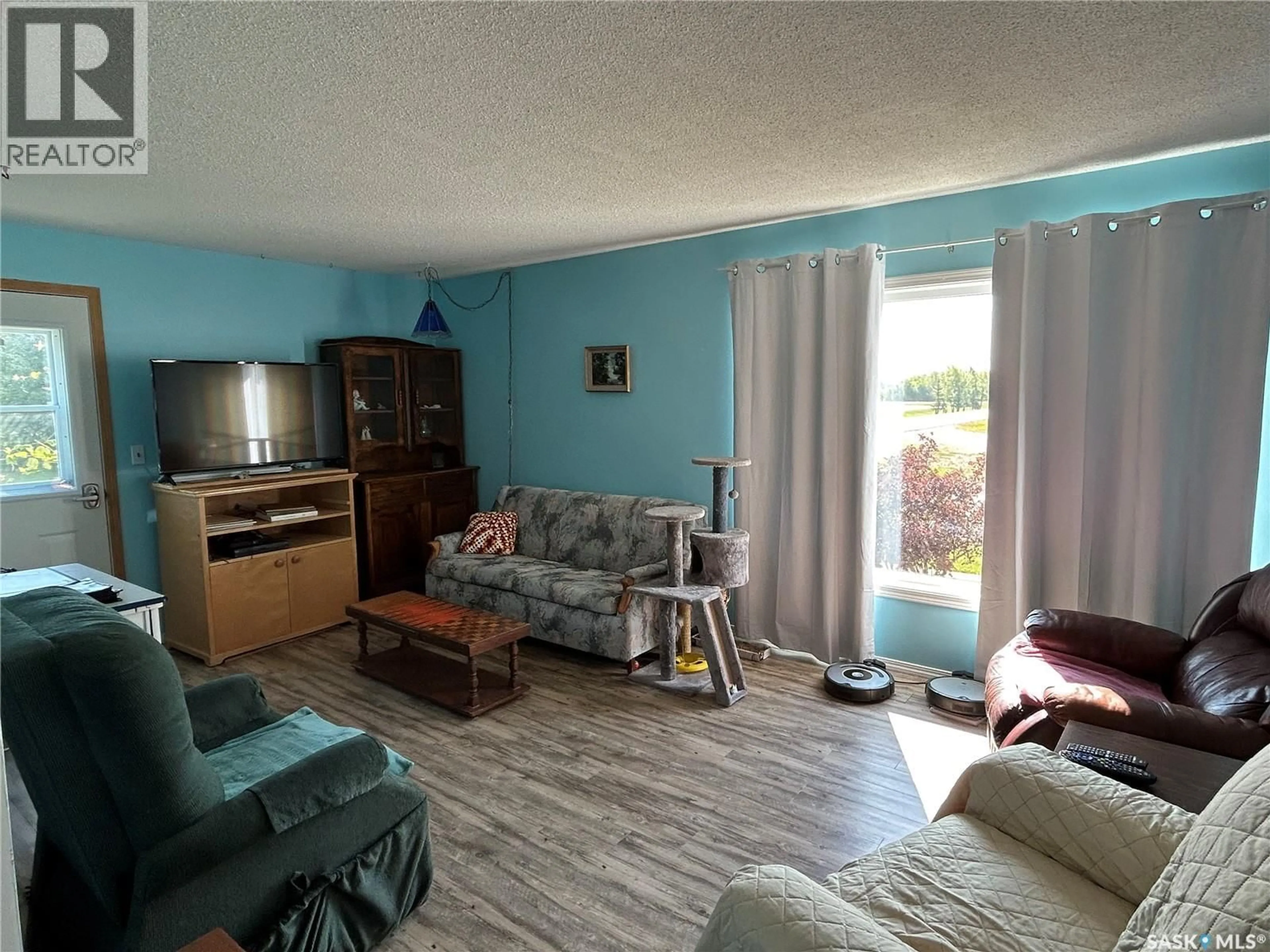 Living room with furniture, unknown for 107 RAILWAY AVENUE, Middle Lake Saskatchewan S0K2X0