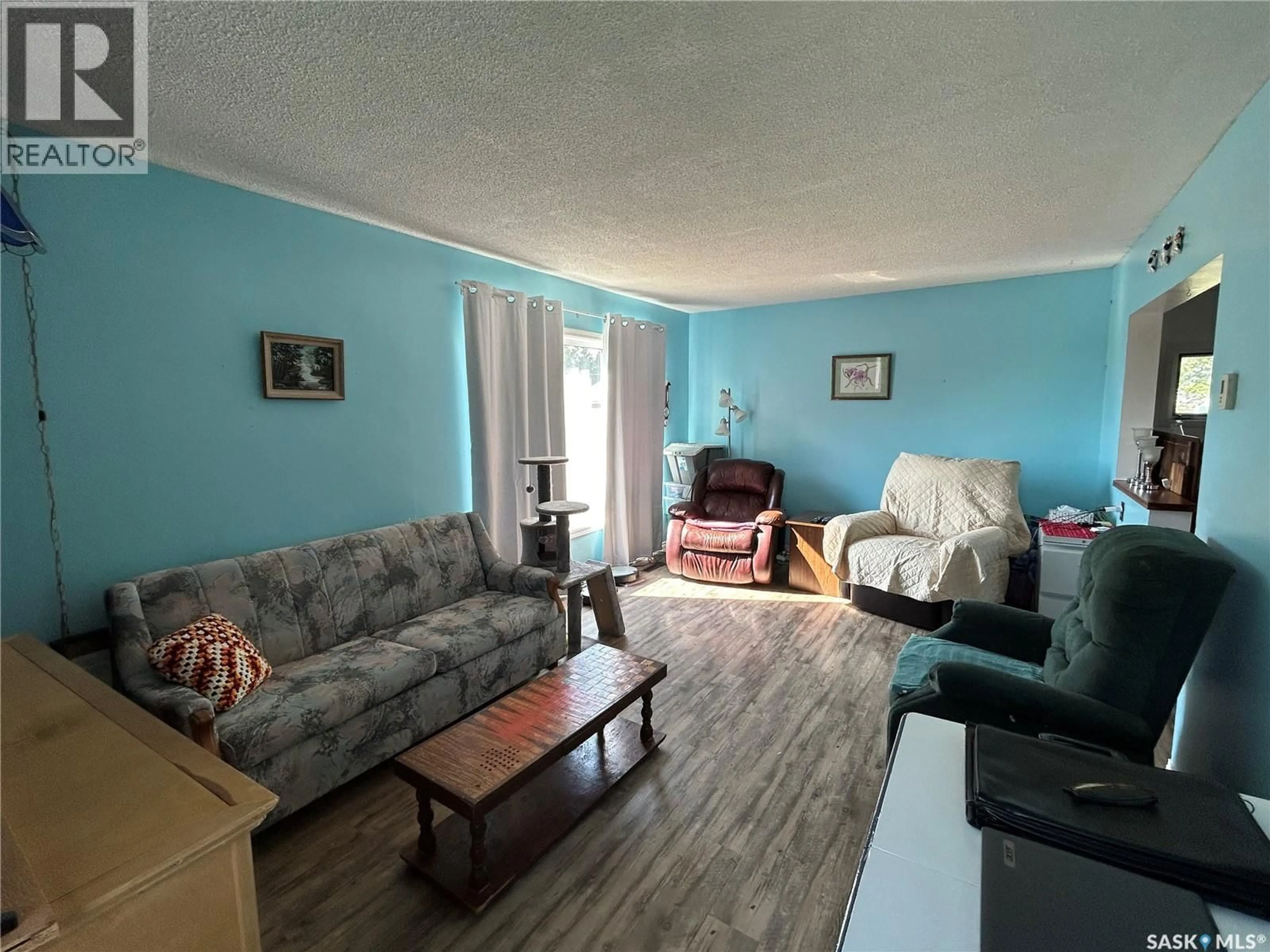 Living room with furniture, unknown for 107 RAILWAY AVENUE, Middle Lake Saskatchewan S0K2X0