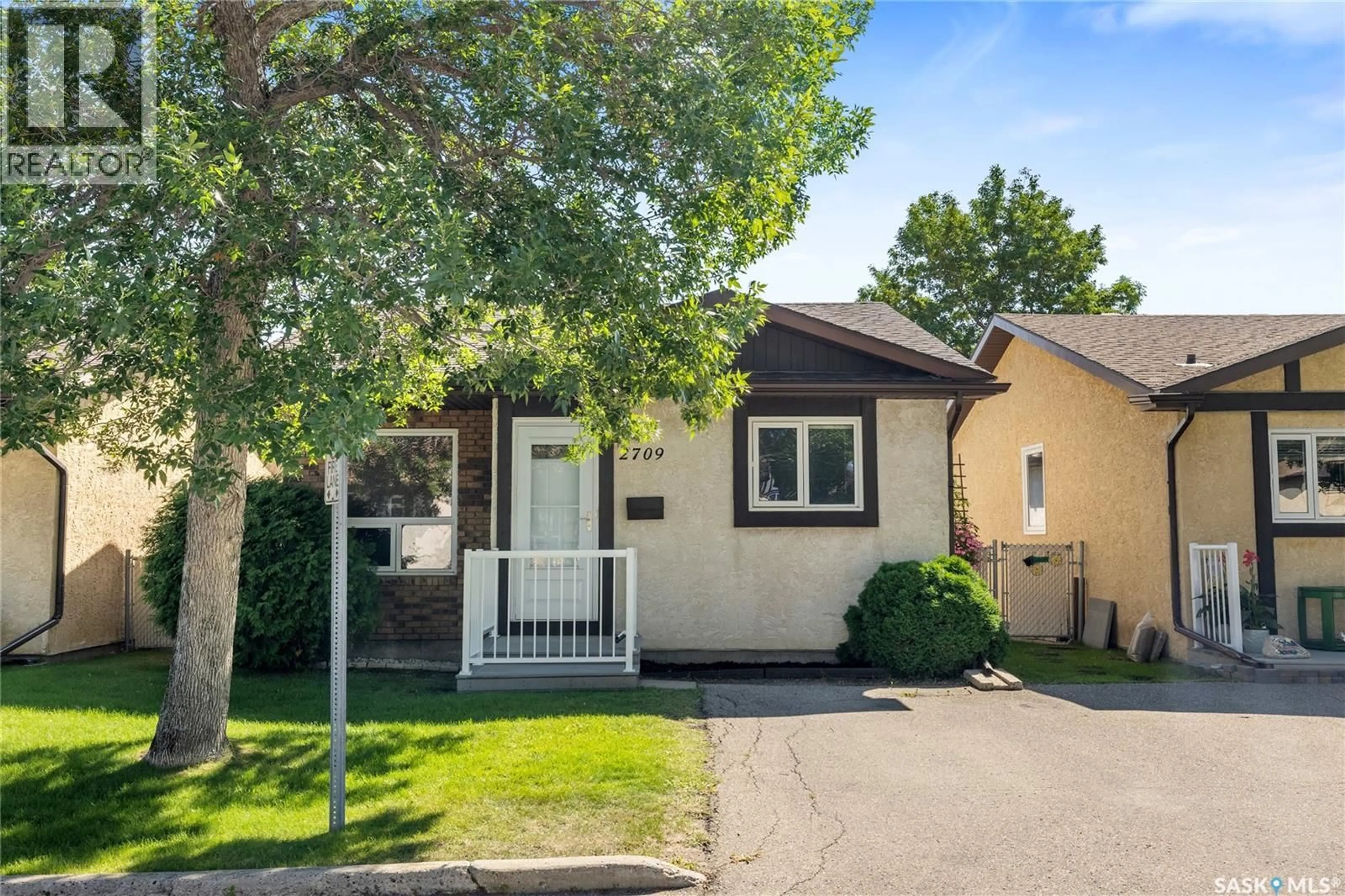 Home with vinyl exterior material, street for E - 2709 MEADOW LANE, Regina Saskatchewan S4V1L7