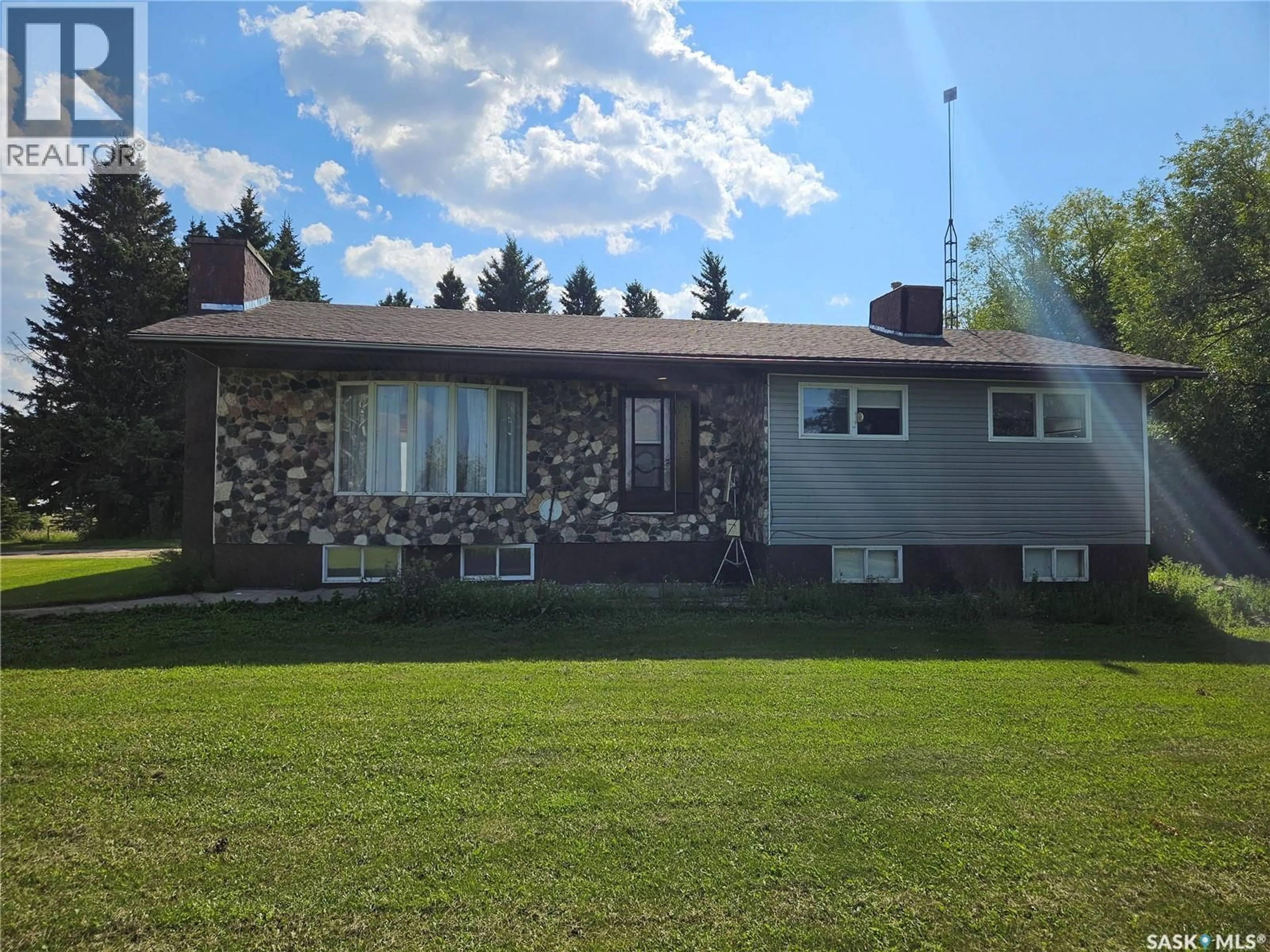 Home with vinyl exterior material, street for GRILLER ACREAGE, Spalding Rm No. 368 Saskatchewan A0A3E0