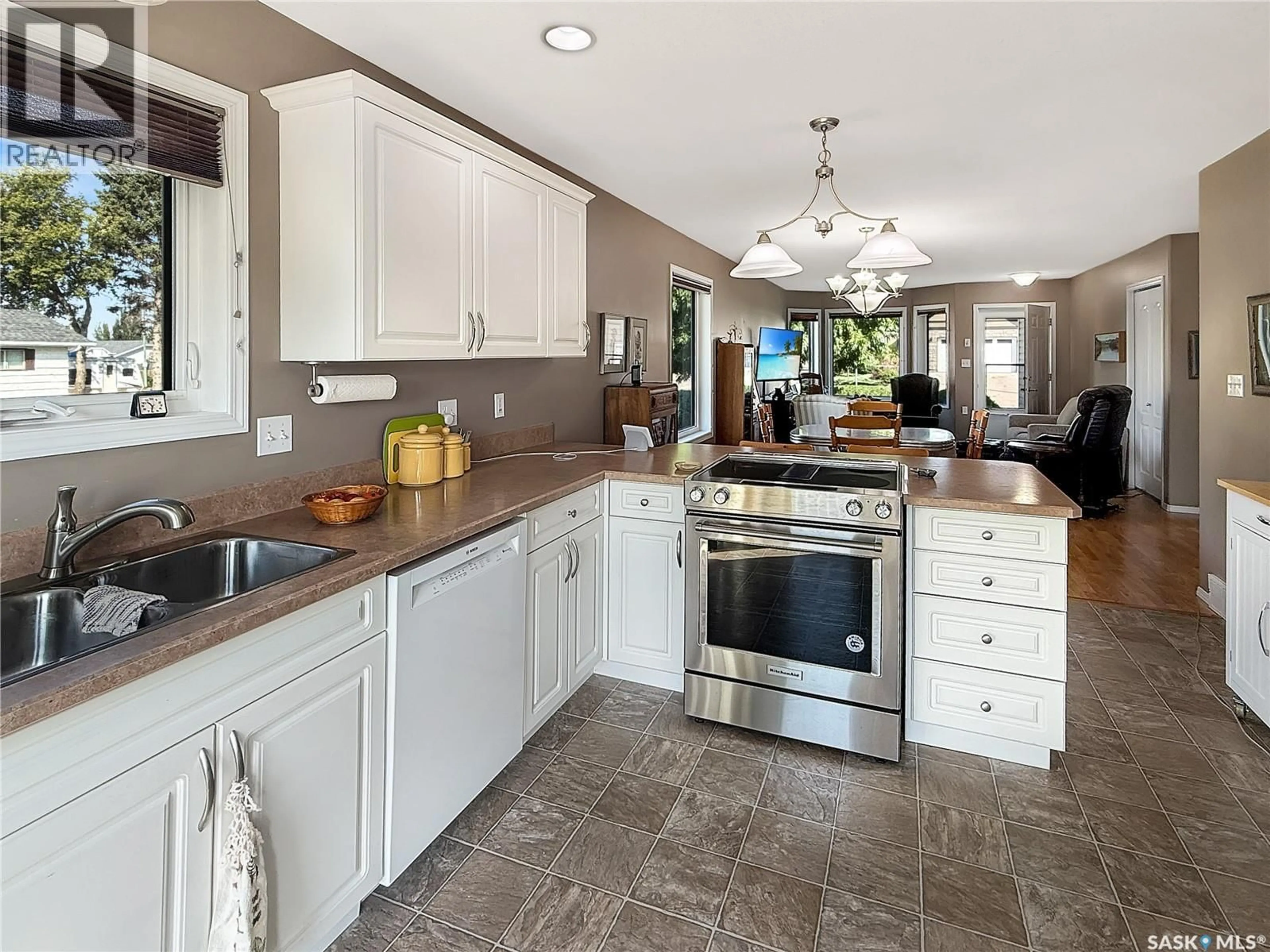 Open concept kitchen, ceramic/tile floor for 10302 HENDERSON DRIVE, North Battleford Saskatchewan S9A3Y3