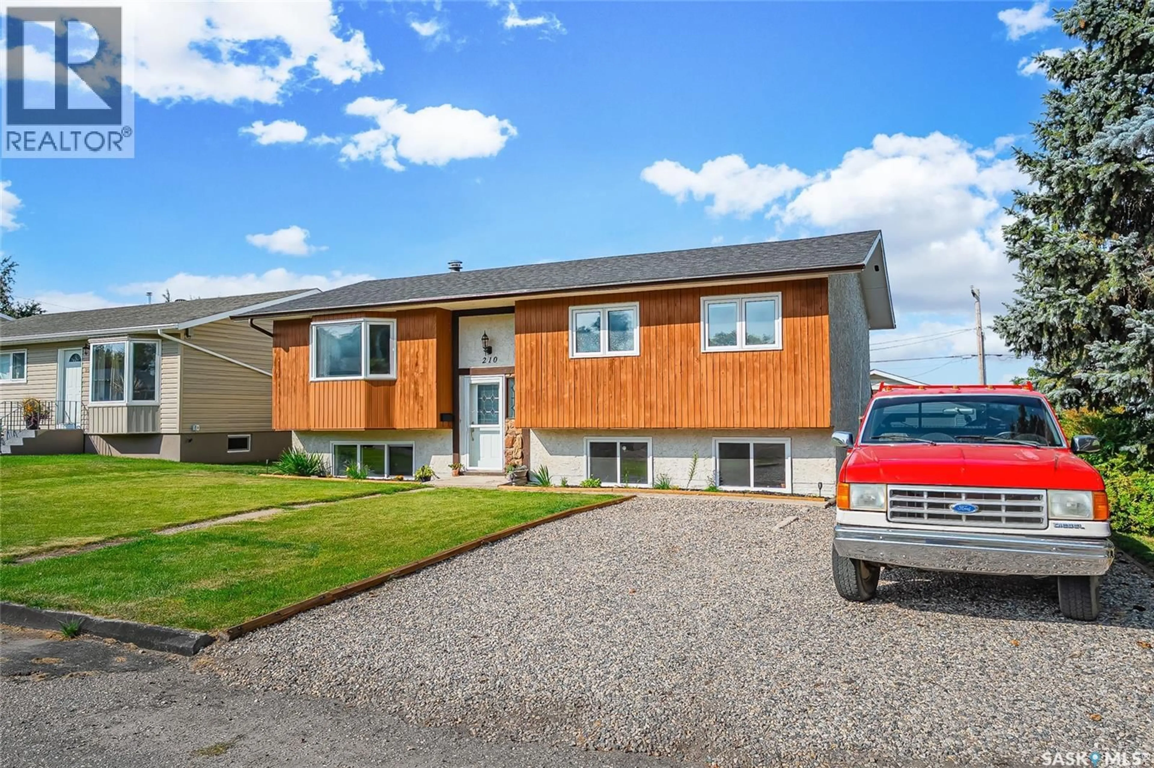 Home with vinyl exterior material, street for 210 4TH STREET, Delisle Saskatchewan S0L0P0
