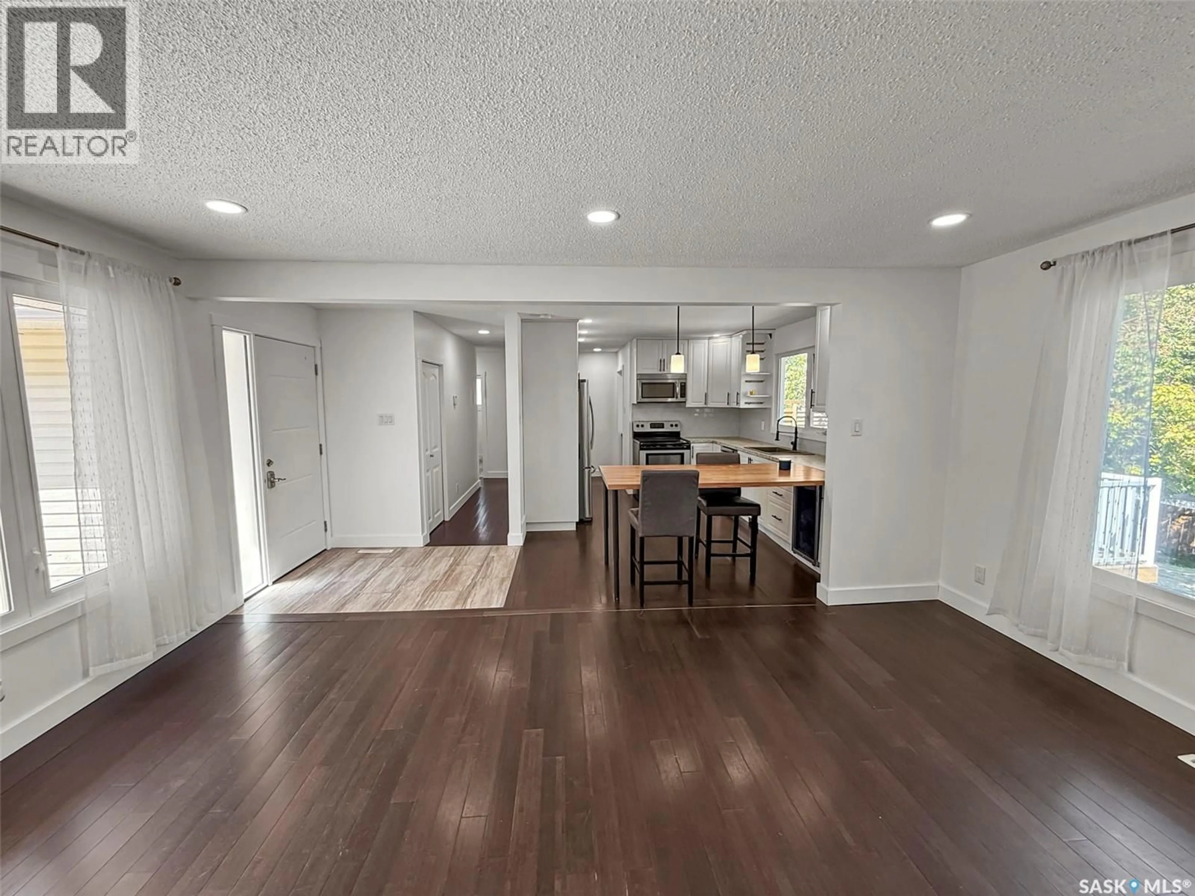Open concept kitchen, wood/laminate floor for 201 CONLIN DRIVE, Swift Current Saskatchewan S9H3A9