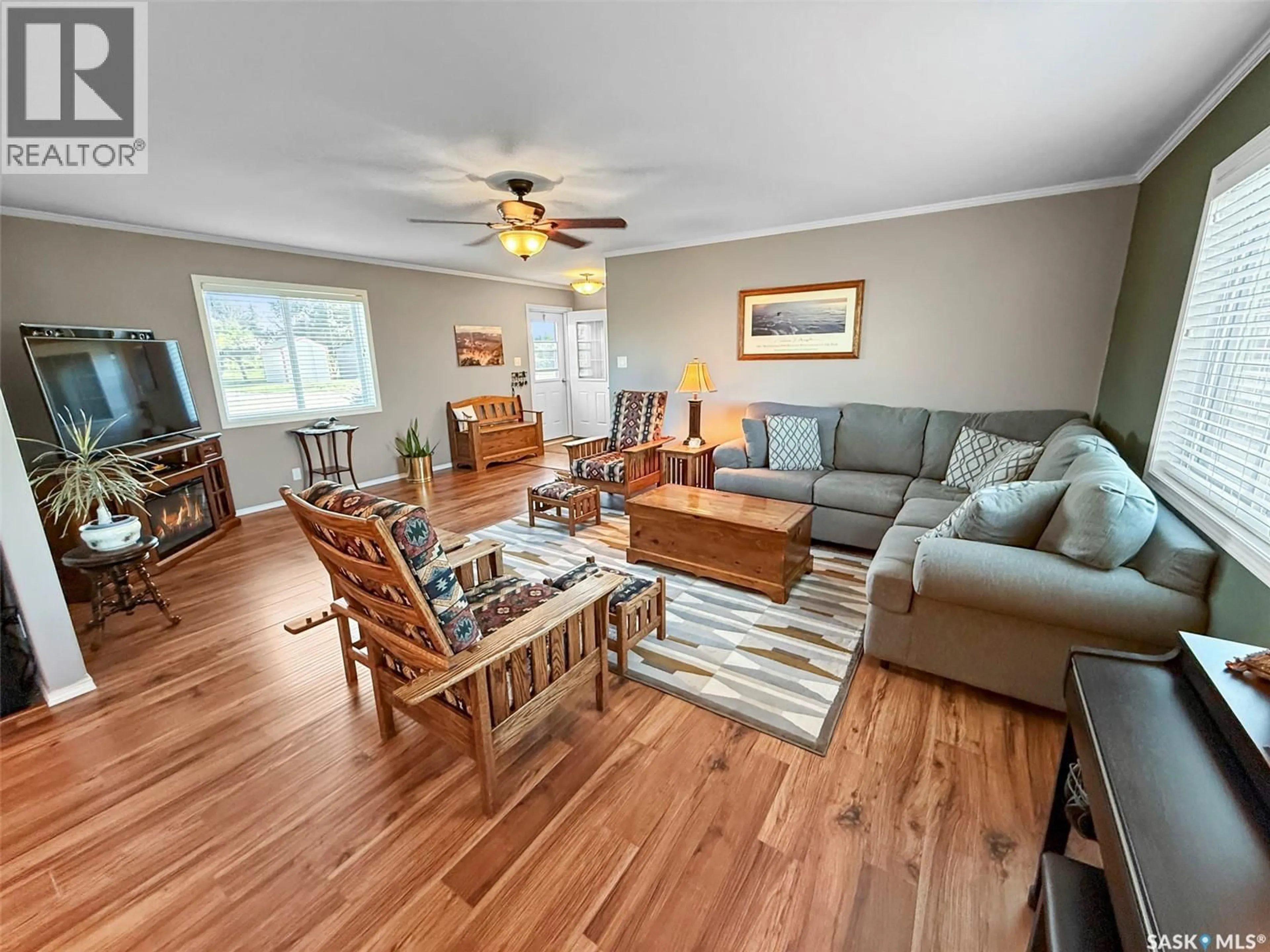 Living room with furniture, wood/laminate floor for 116 HERBERT AVENUE, Herbert Saskatchewan S0H2A0