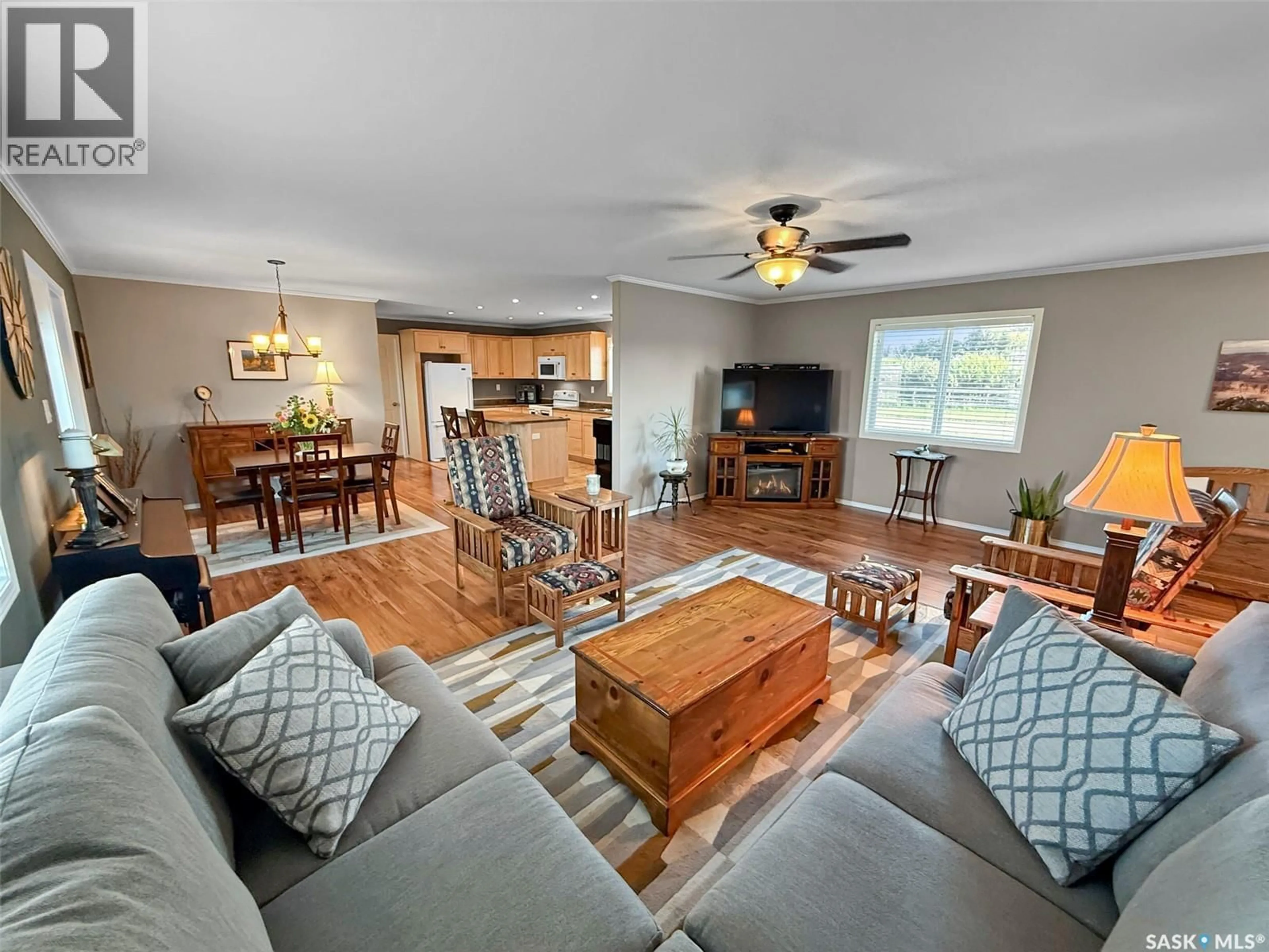 Living room with furniture, wood/laminate floor for 116 HERBERT AVENUE, Herbert Saskatchewan S0H2A0