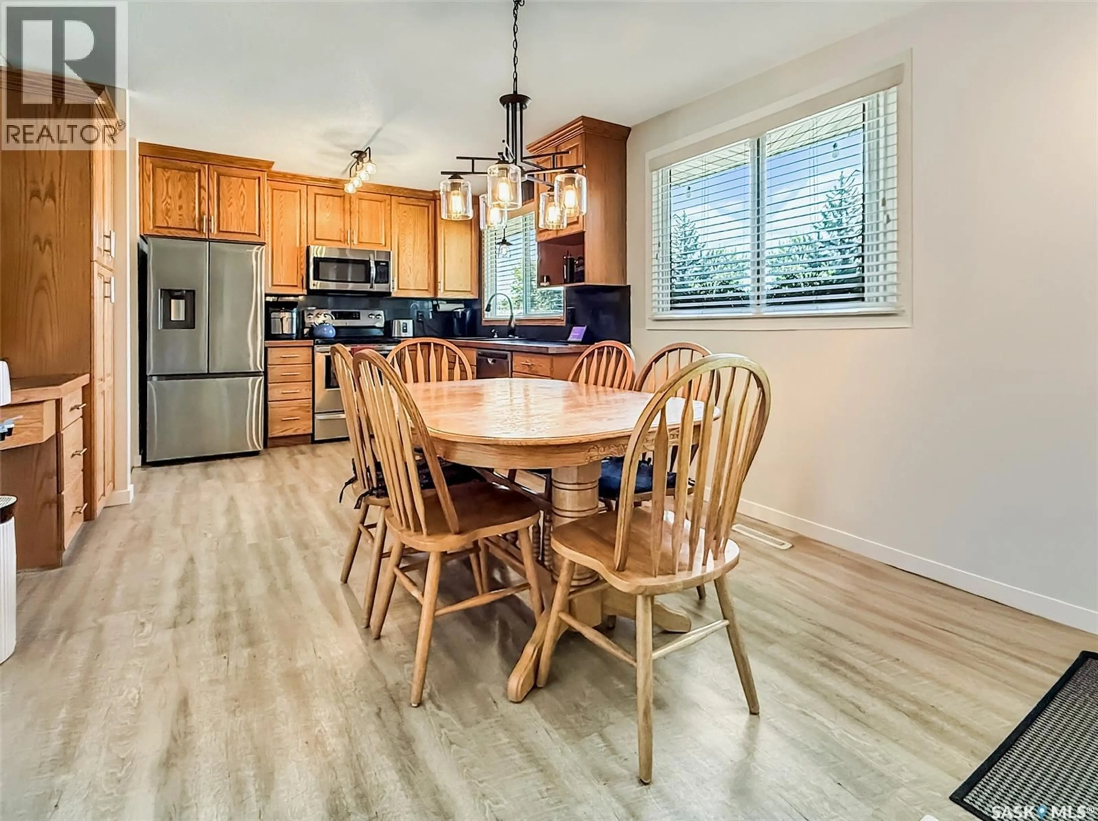 Open concept kitchen, wood/laminate floor for 80 MACDONALD CRESCENT, Swift Current Saskatchewan S9H1P4
