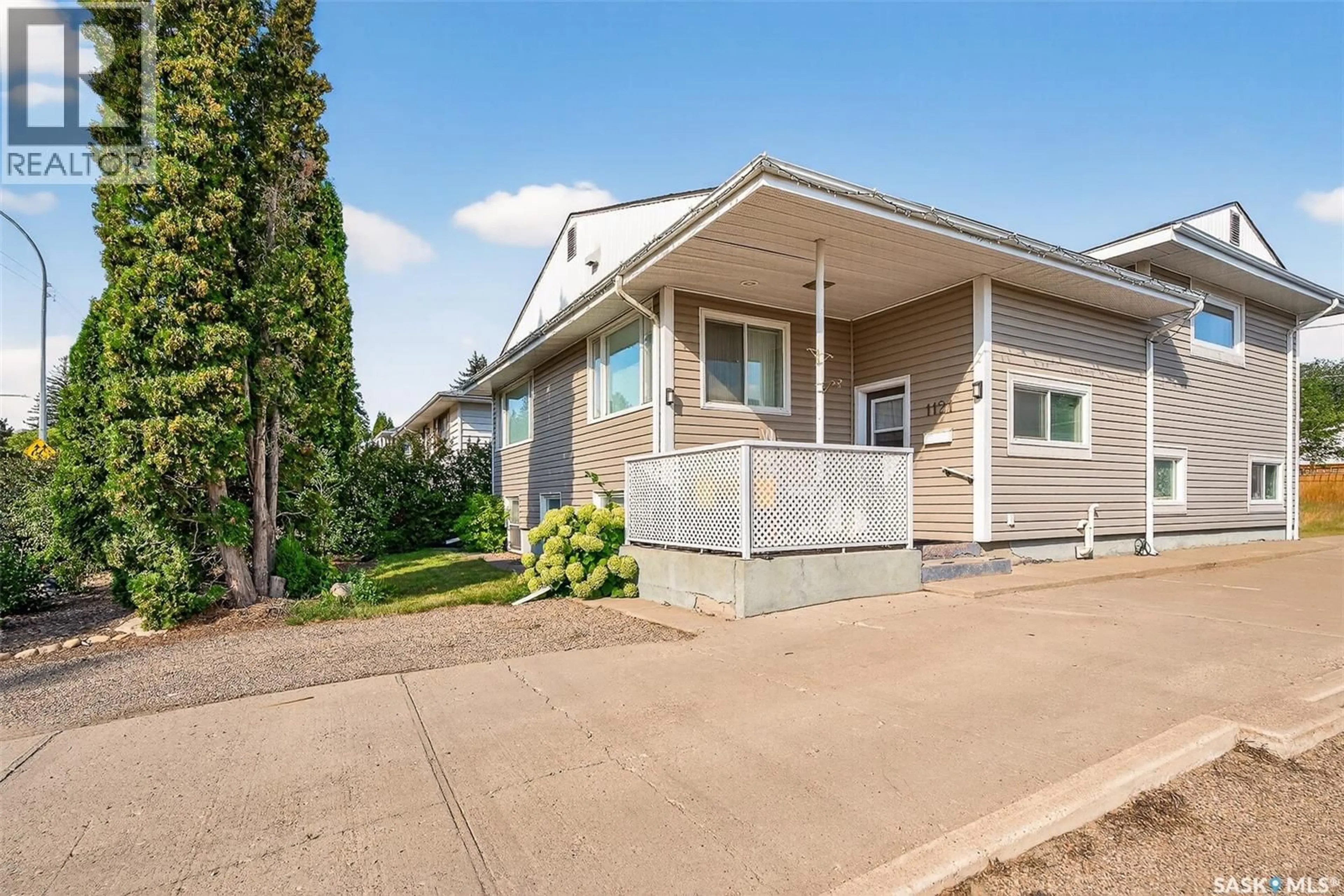 Home with vinyl exterior material, street for 1121 MAIN STREET, Moose Jaw Saskatchewan S6H0X3