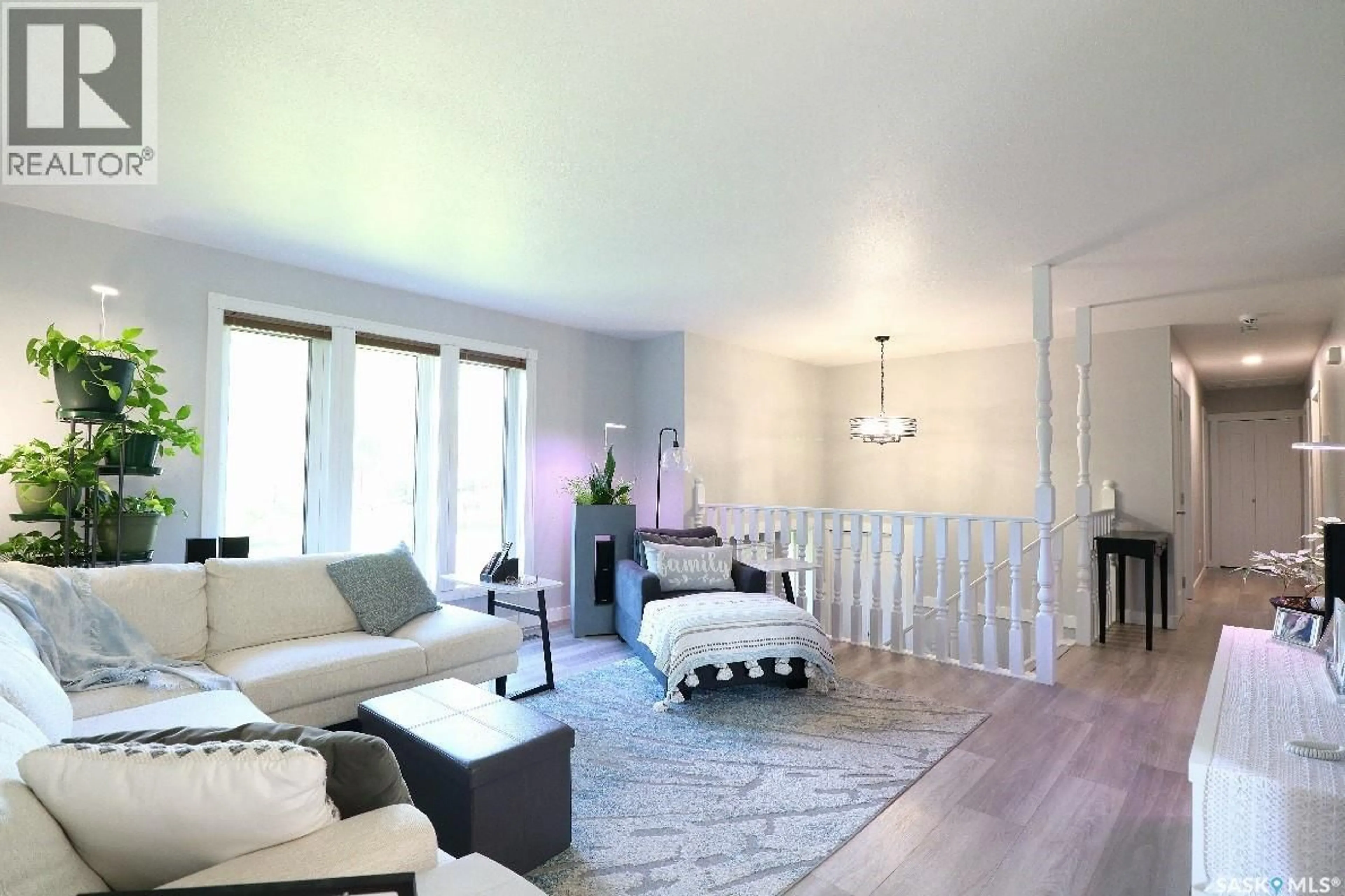 Living room with furniture, wood/laminate floor for 414 HARRIS STREET, Yorkton Saskatchewan S3N3T6