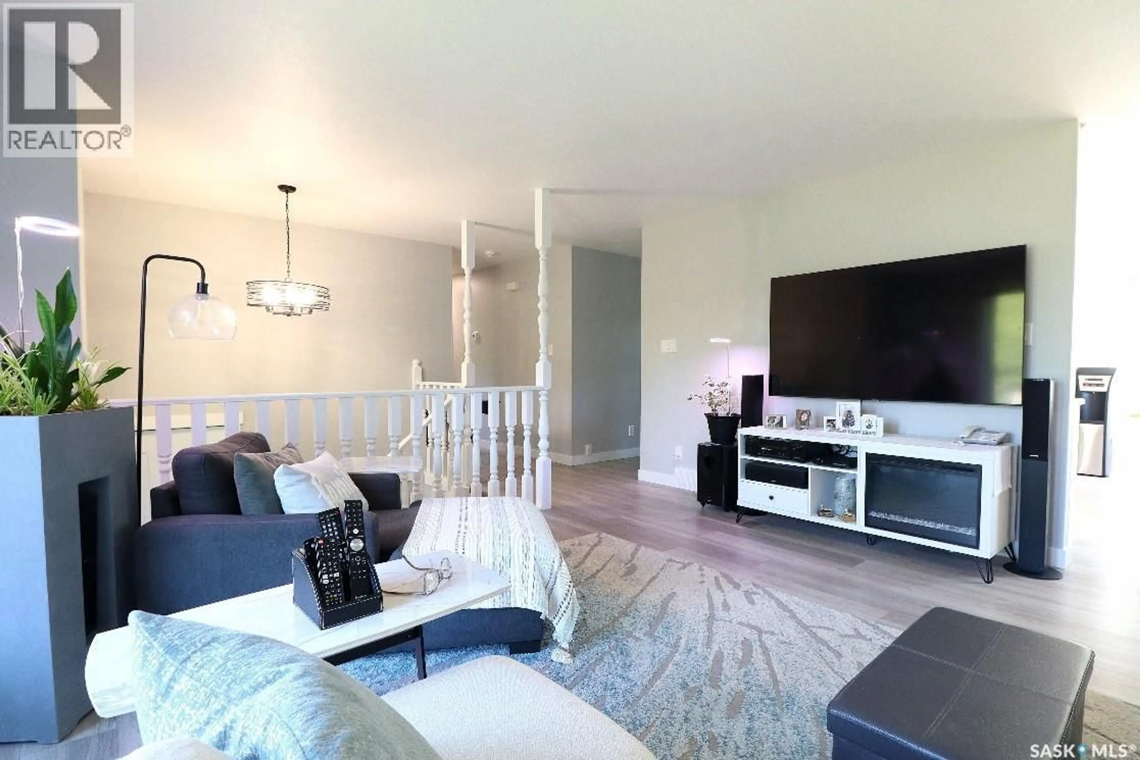 Living room with furniture, wood/laminate floor for 414 HARRIS STREET, Yorkton Saskatchewan S3N3T6