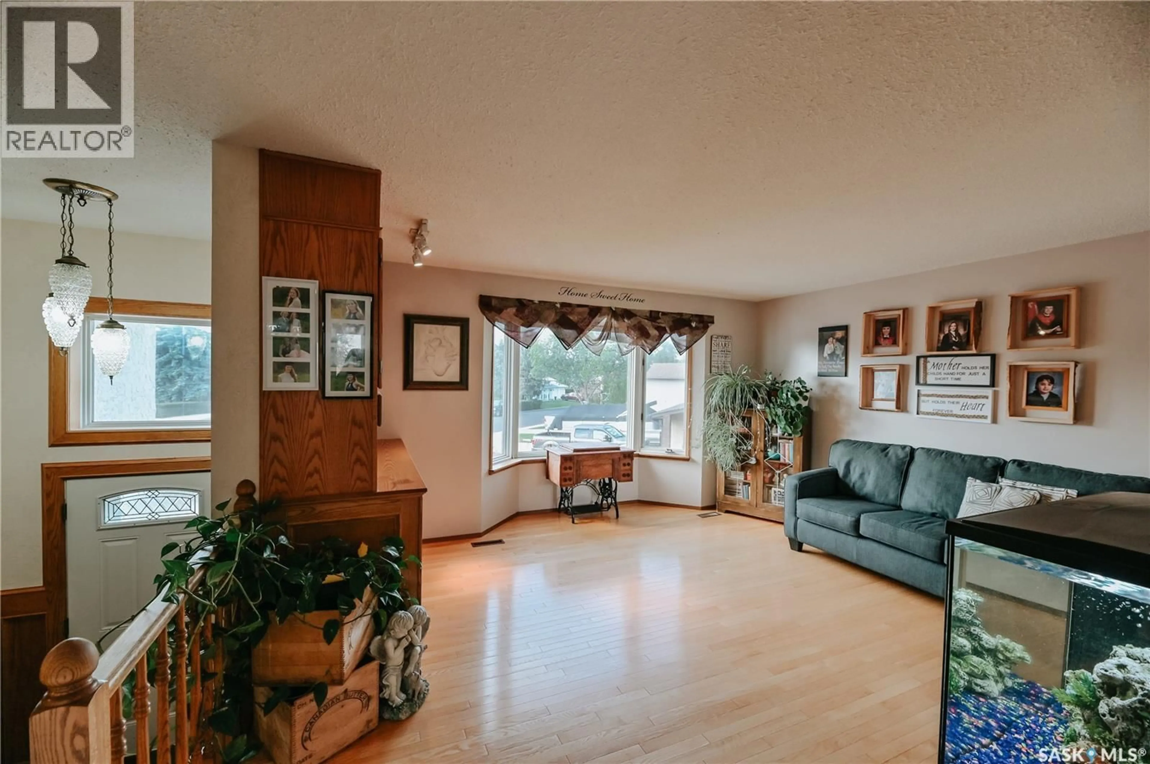Living room with furniture, wood/laminate floor for 3385 DENT CRESCENT, Prince Albert Saskatchewan S6V7H2