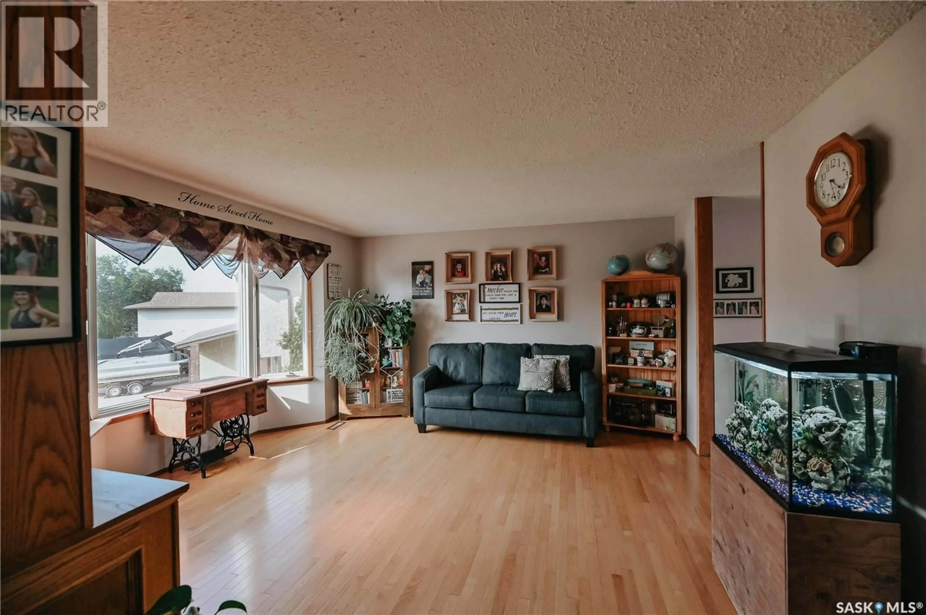 Living room with furniture, wood/laminate floor for 3385 DENT CRESCENT, Prince Albert Saskatchewan S6V7H2