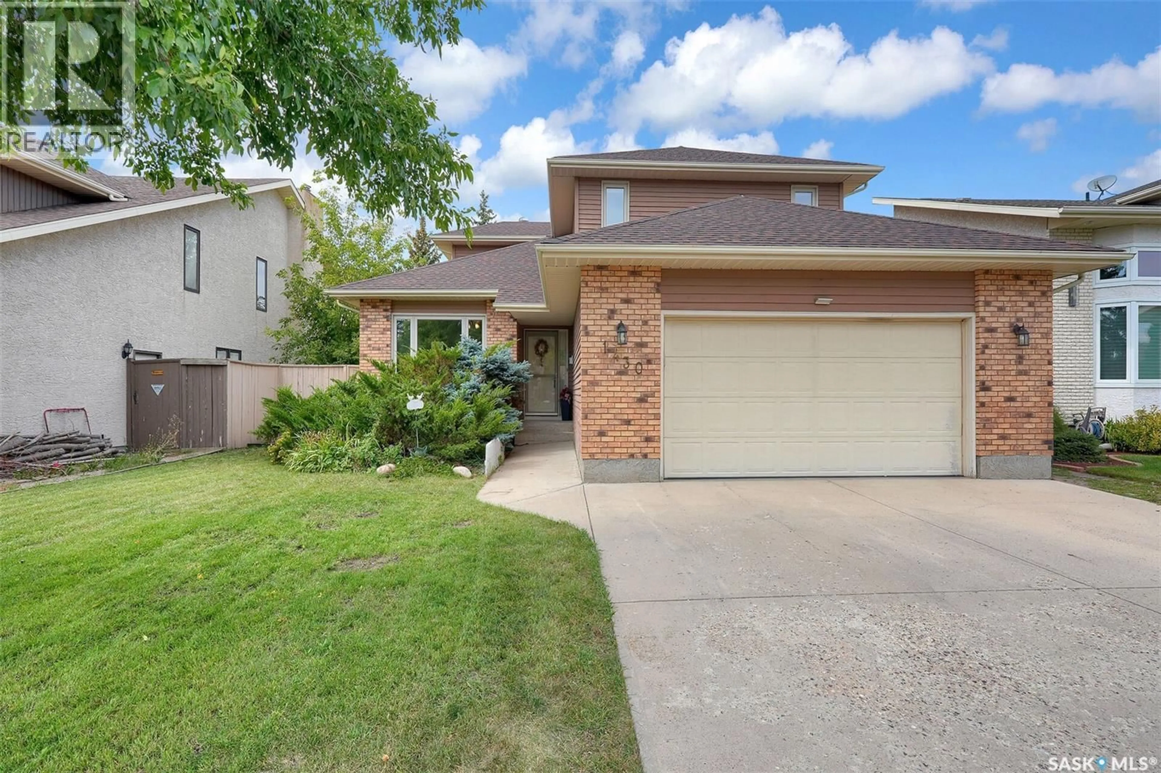 Home with brick exterior material, street for 1430 WASCANA HIGHLANDS, Regina Saskatchewan S4V2K2