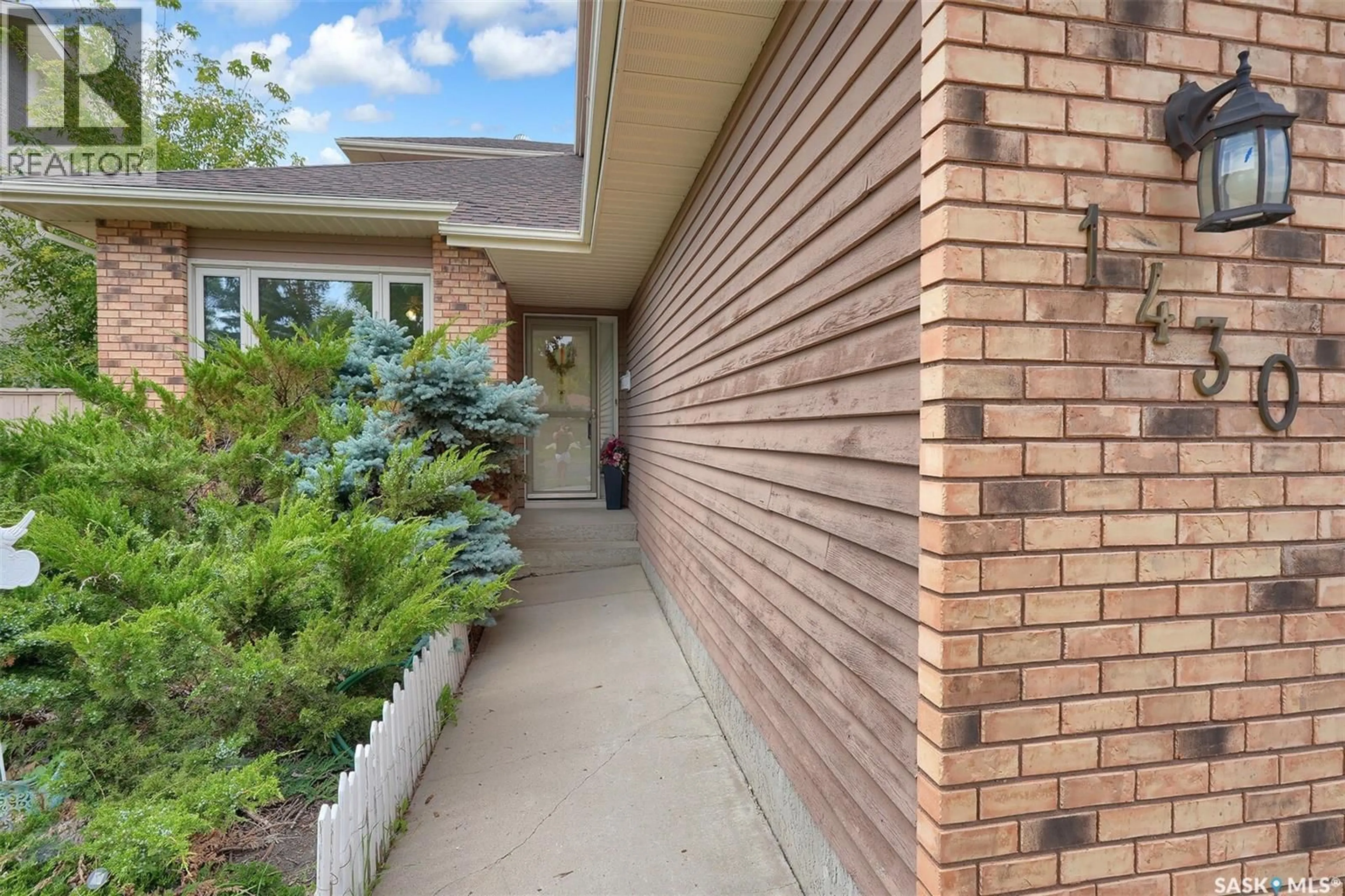 Home with brick exterior material, street for 1430 WASCANA HIGHLANDS, Regina Saskatchewan S4V2K2