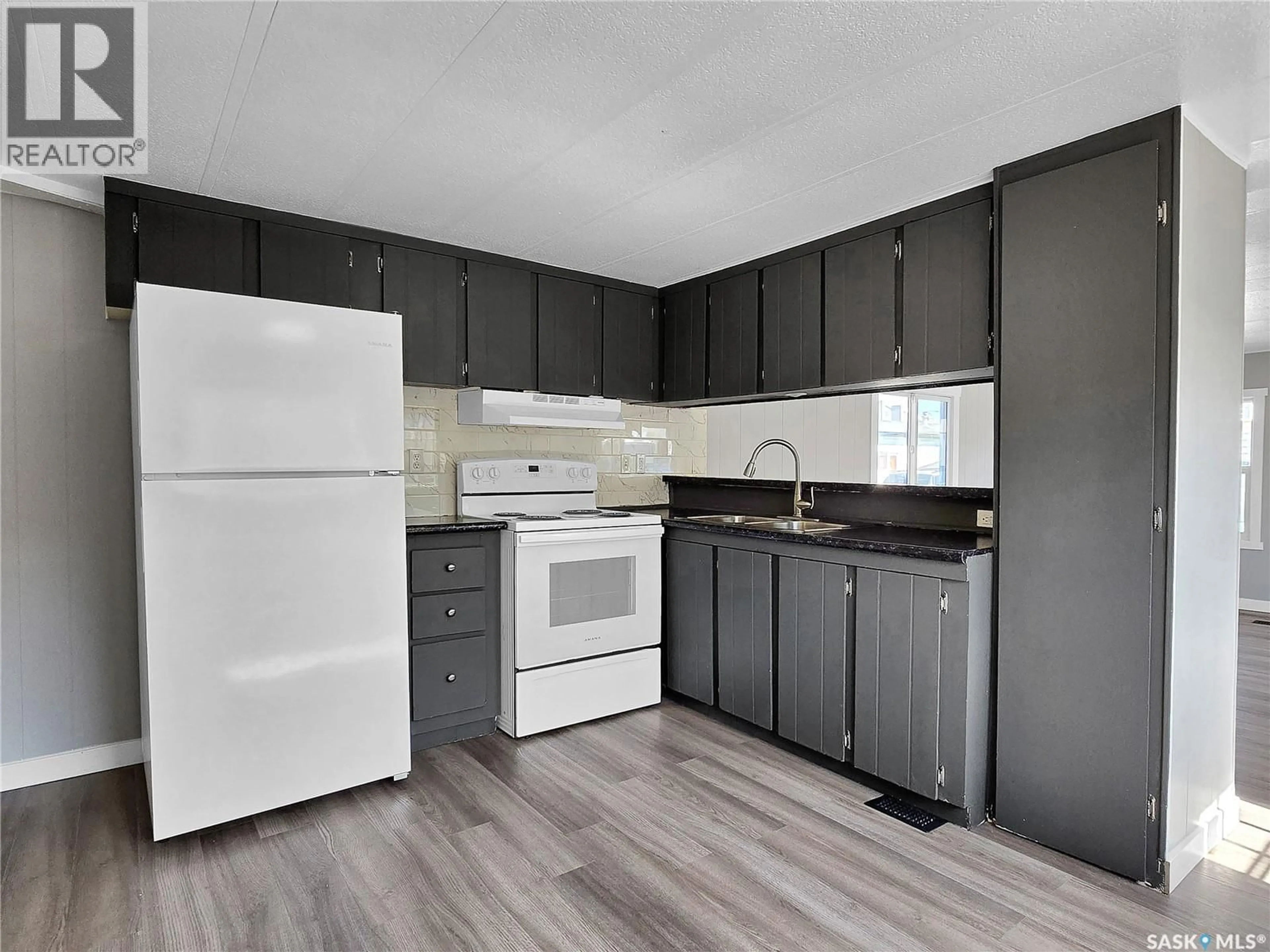 Standard kitchen, wood/laminate floor for 219 - 5 GRANT STREET, Saskatoon Saskatchewan S7H0S4