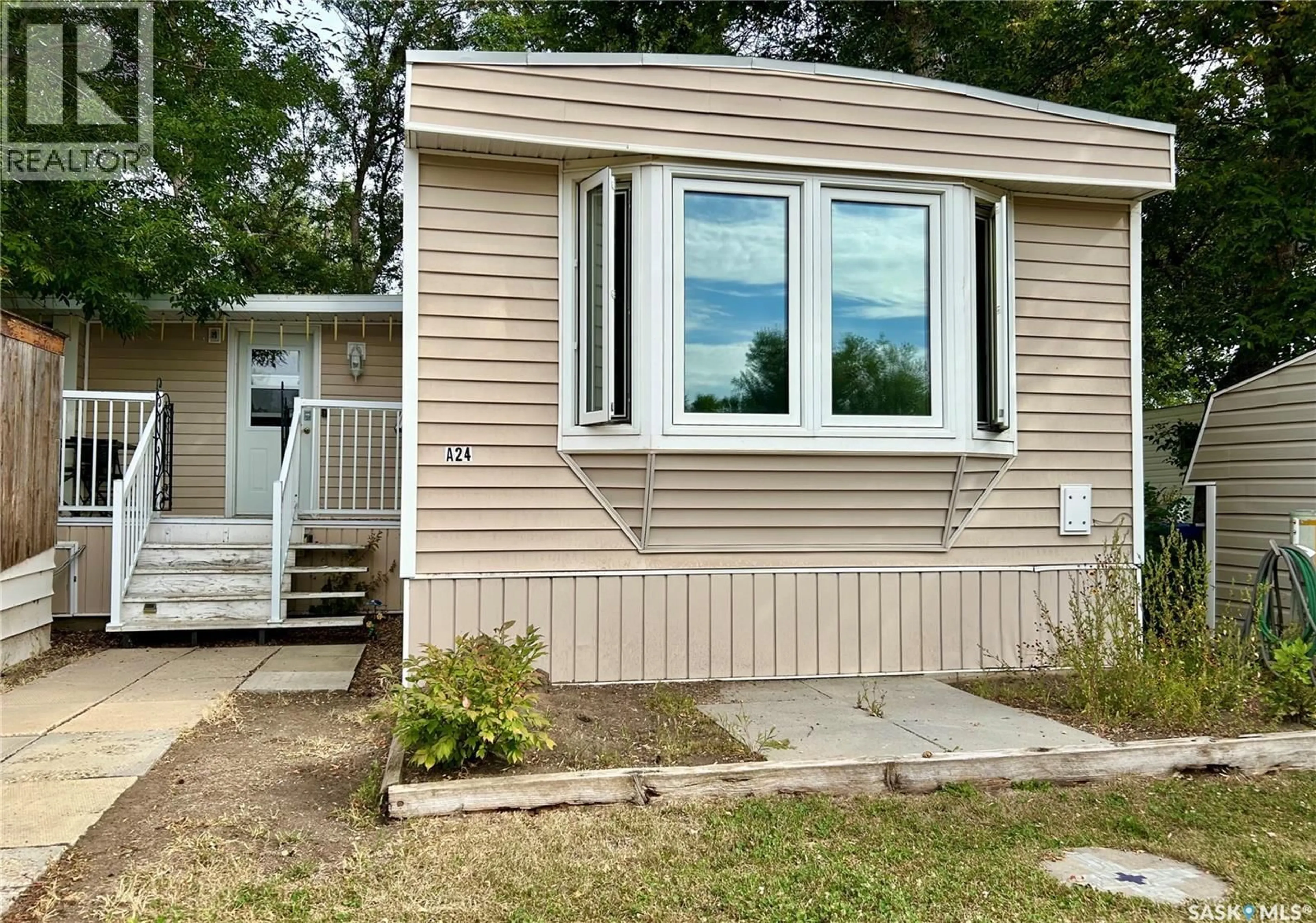 Home with vinyl exterior material, unknown for A24 - 1295 9TH AVENUE, Moose Jaw Saskatchewan S6J1C5