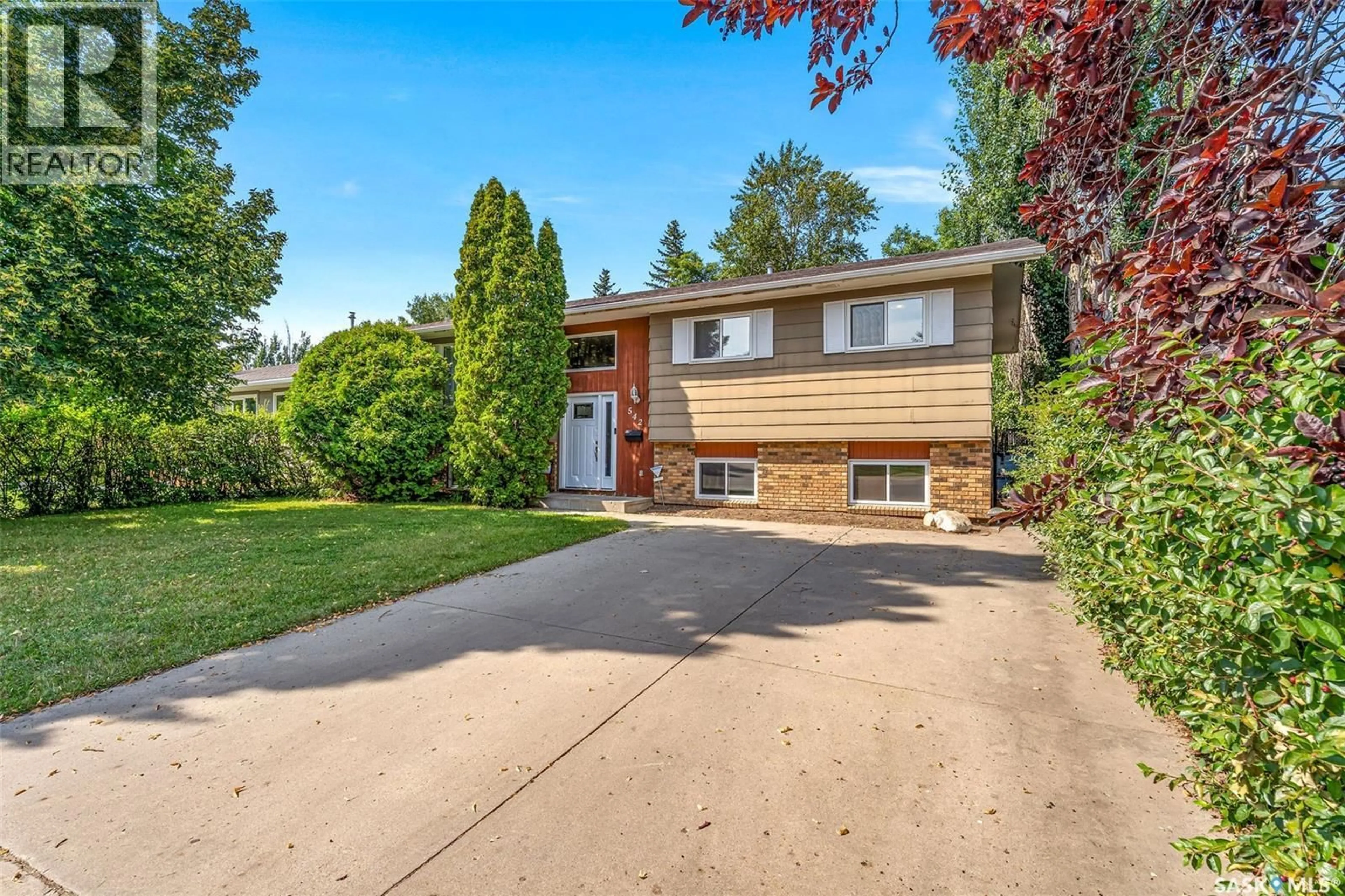 Home with brick exterior material, street for 542 REDBERRY ROAD, Saskatoon Saskatchewan S7K4S3