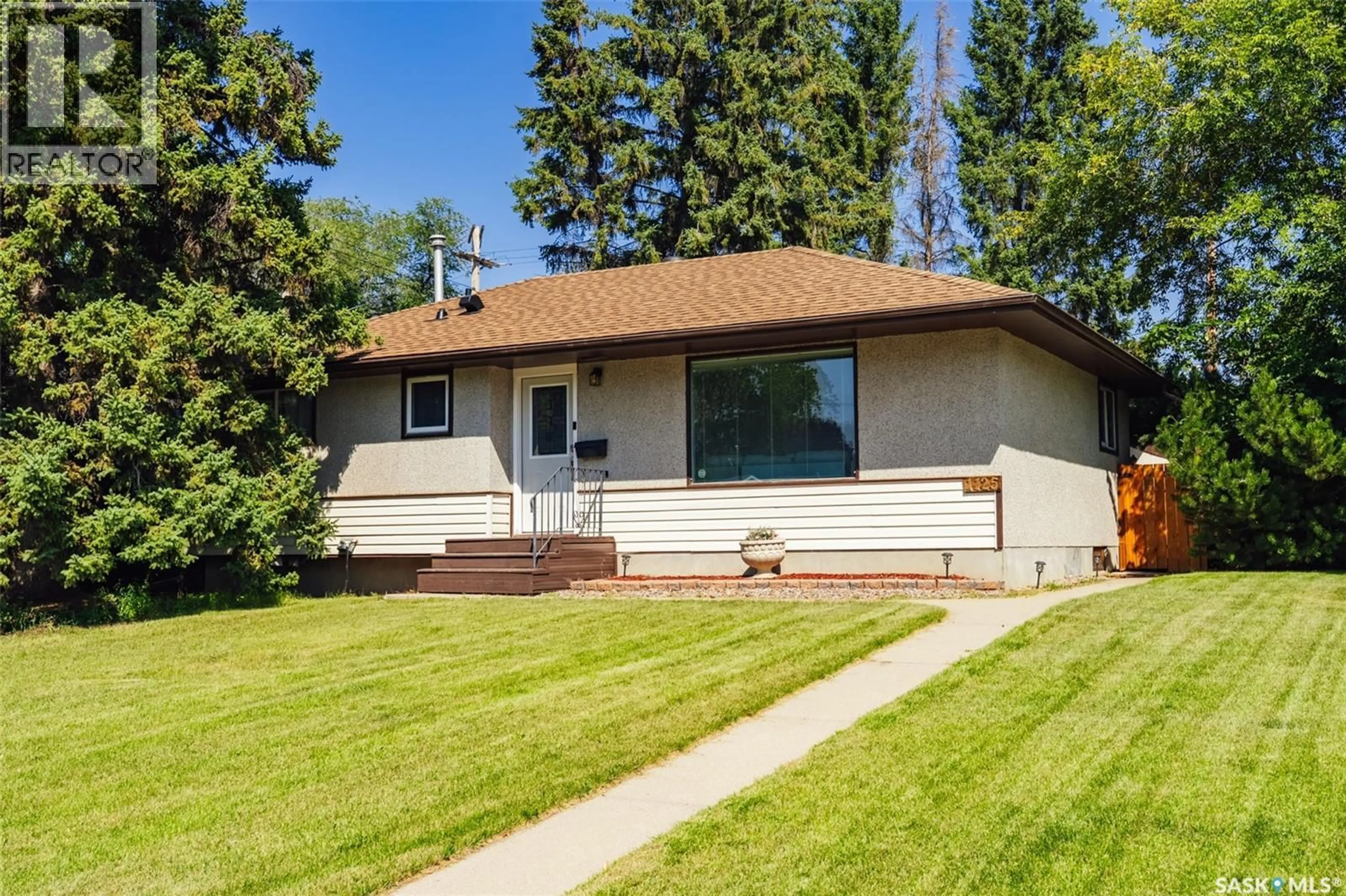 Home with vinyl exterior material, street for 1125 WILSON CRESCENT, Saskatoon Saskatchewan S7J2M7