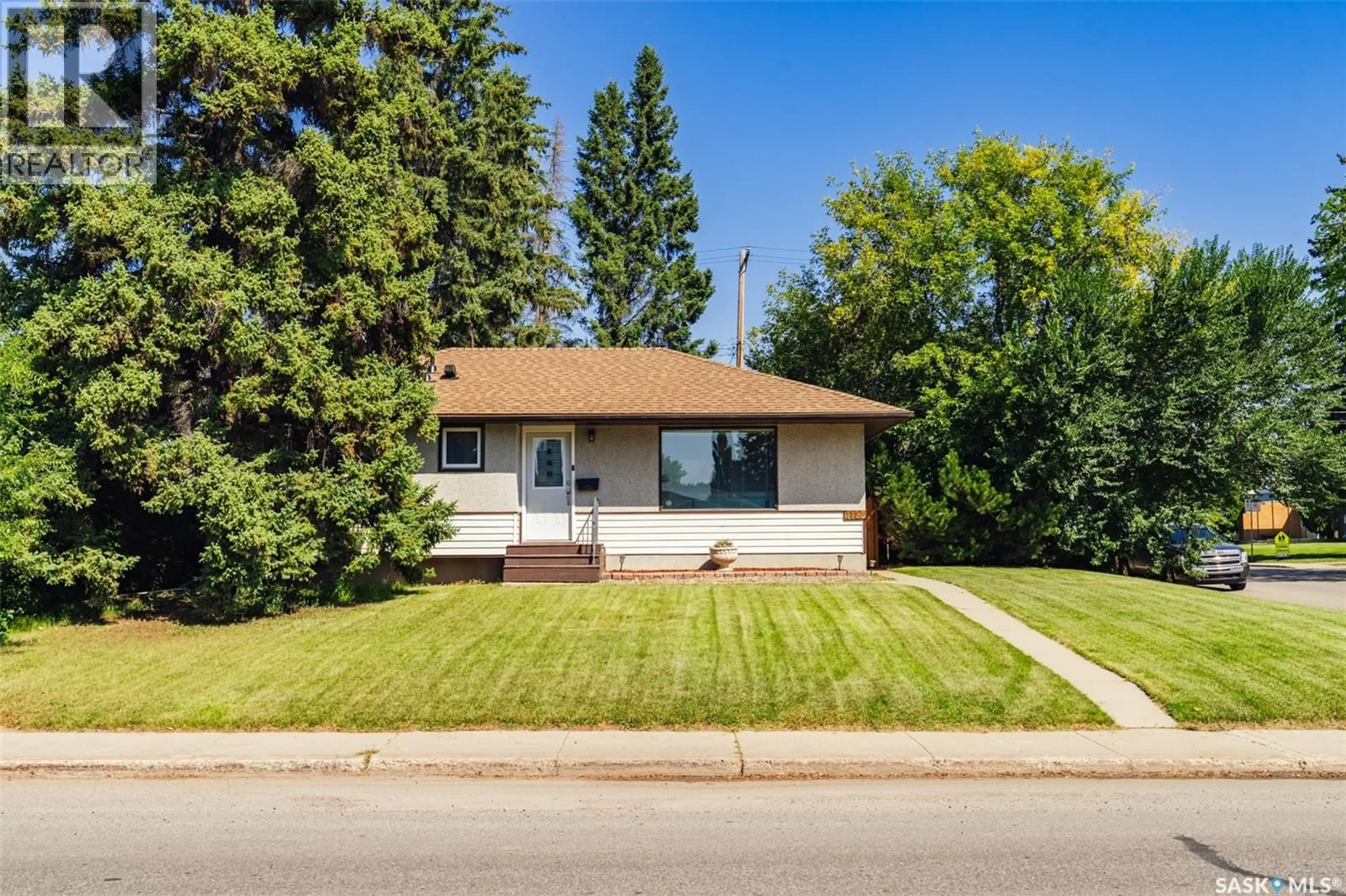 Home with vinyl exterior material, street for 1125 WILSON CRESCENT, Saskatoon Saskatchewan S7J2M7