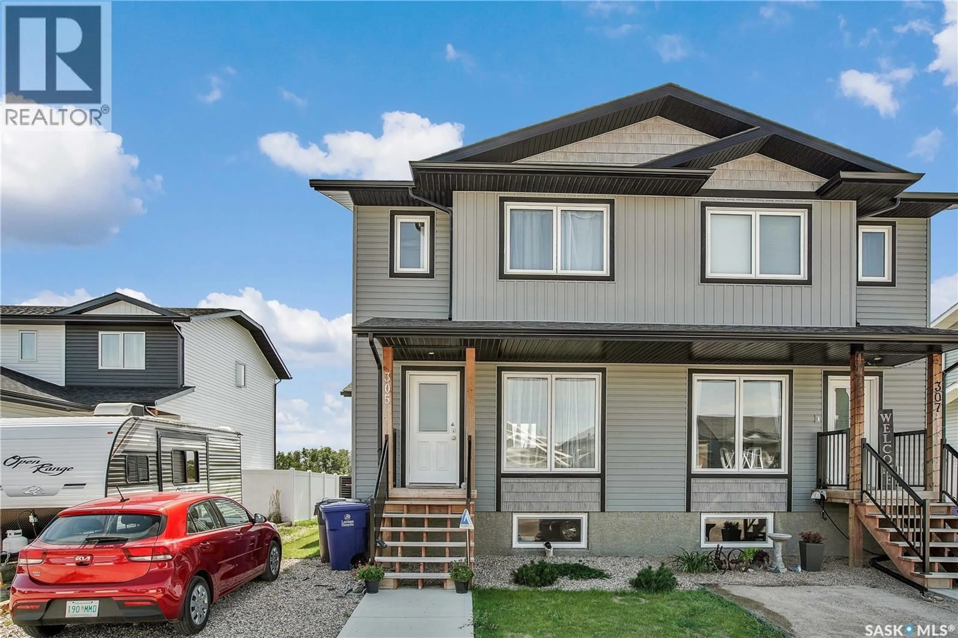 Home with vinyl exterior material, street for 305 REDDEKOPP CRESCENT, Warman Saskatchewan S0K4S3