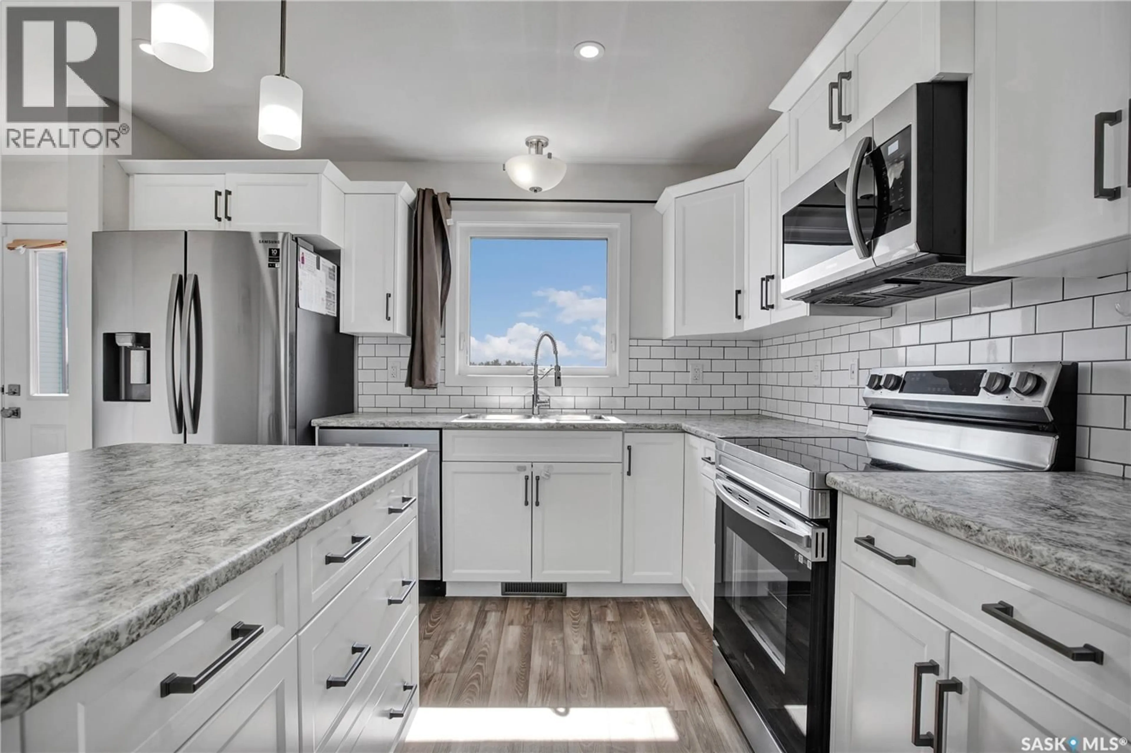 Open concept kitchen, ceramic/tile floor for 305 REDDEKOPP CRESCENT, Warman Saskatchewan S0K4S3