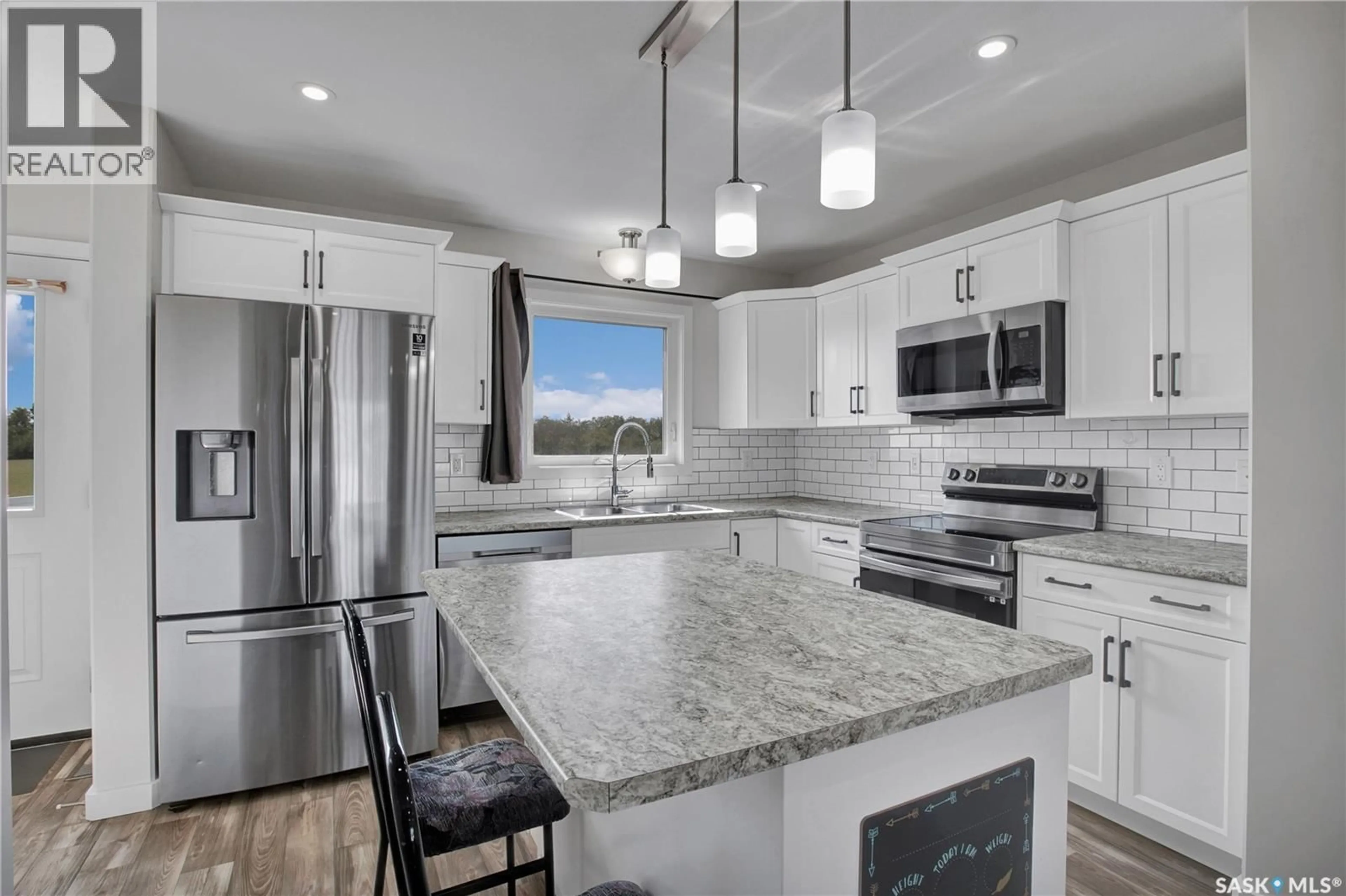Open concept kitchen, ceramic/tile floor for 305 REDDEKOPP CRESCENT, Warman Saskatchewan S0K4S3