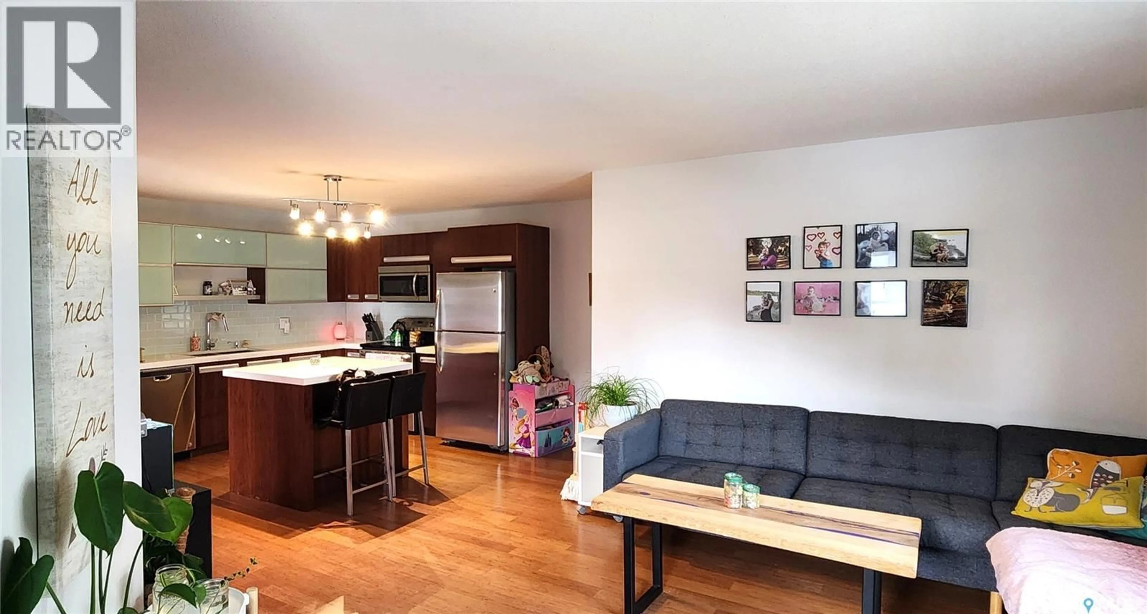 Open concept kitchen, wood/laminate floor for 1015 - 509 PATRICK CRESCENT, Saskatoon Saskatchewan S7W0M1