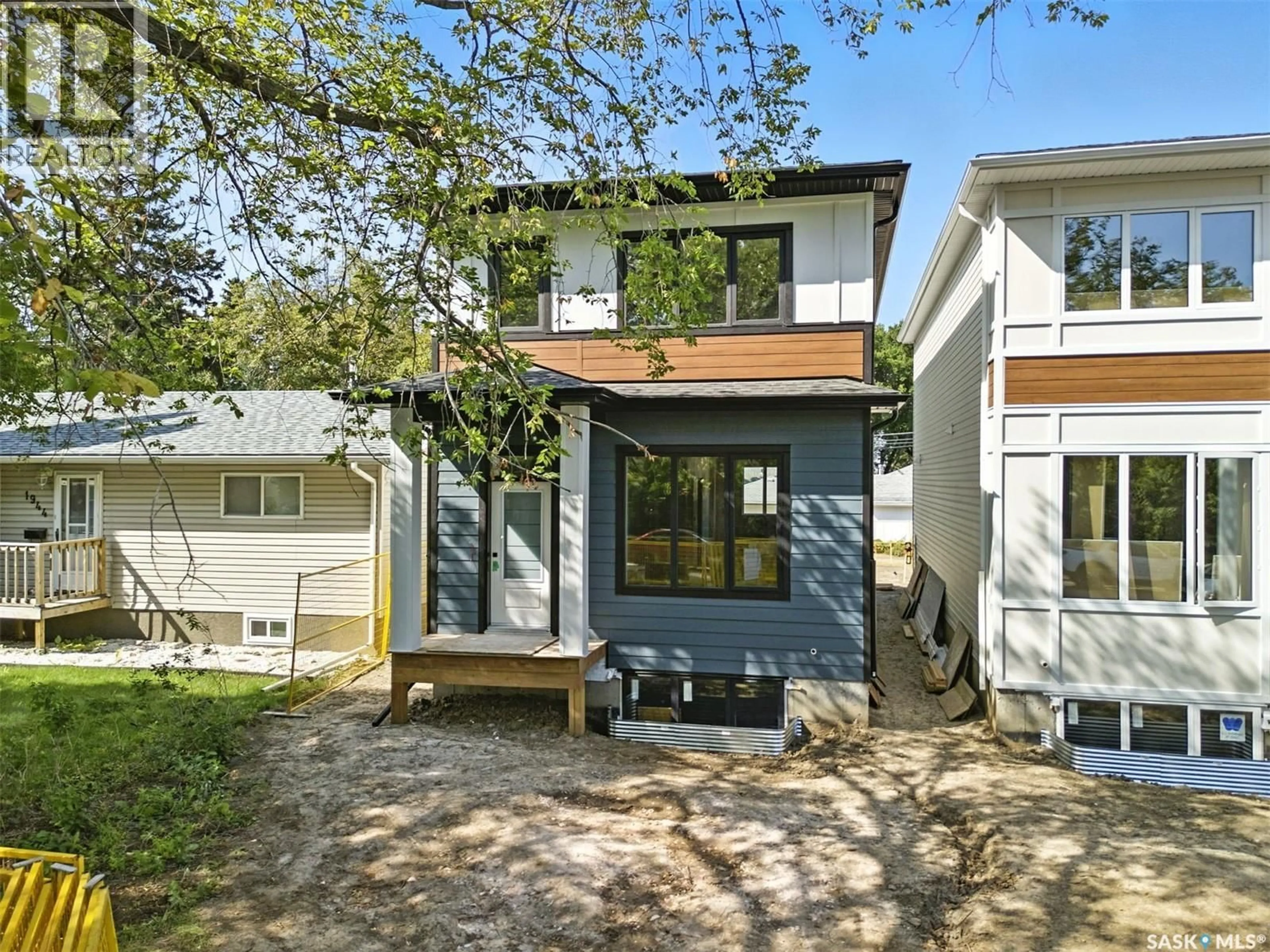 Home with vinyl exterior material, street for 1914 HERMAN AVENUE, Saskatoon Saskatchewan S7M0M8