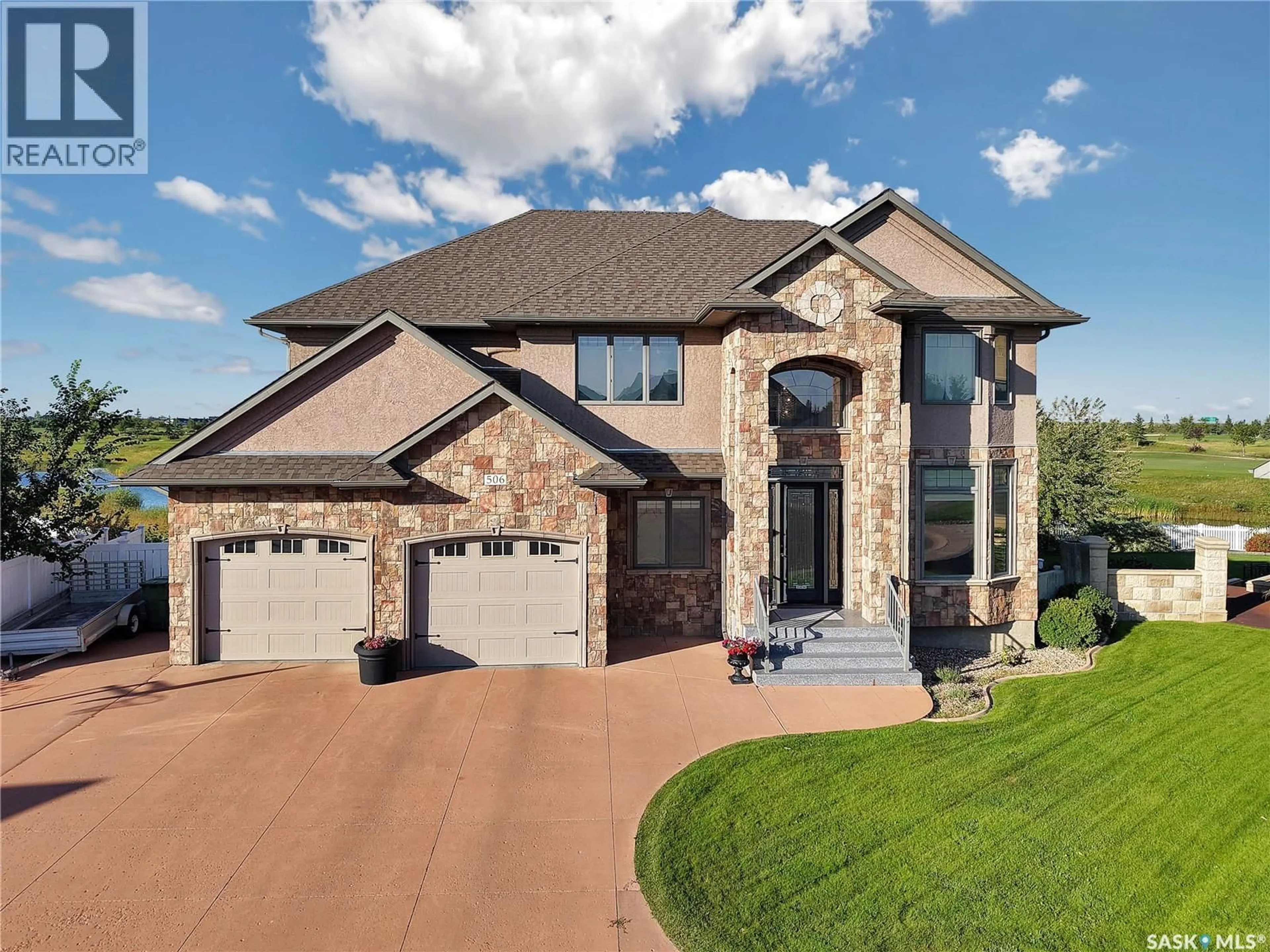 Home with brick exterior material, street for 506 HOGAN GREEN, Warman Saskatchewan S0K4S1