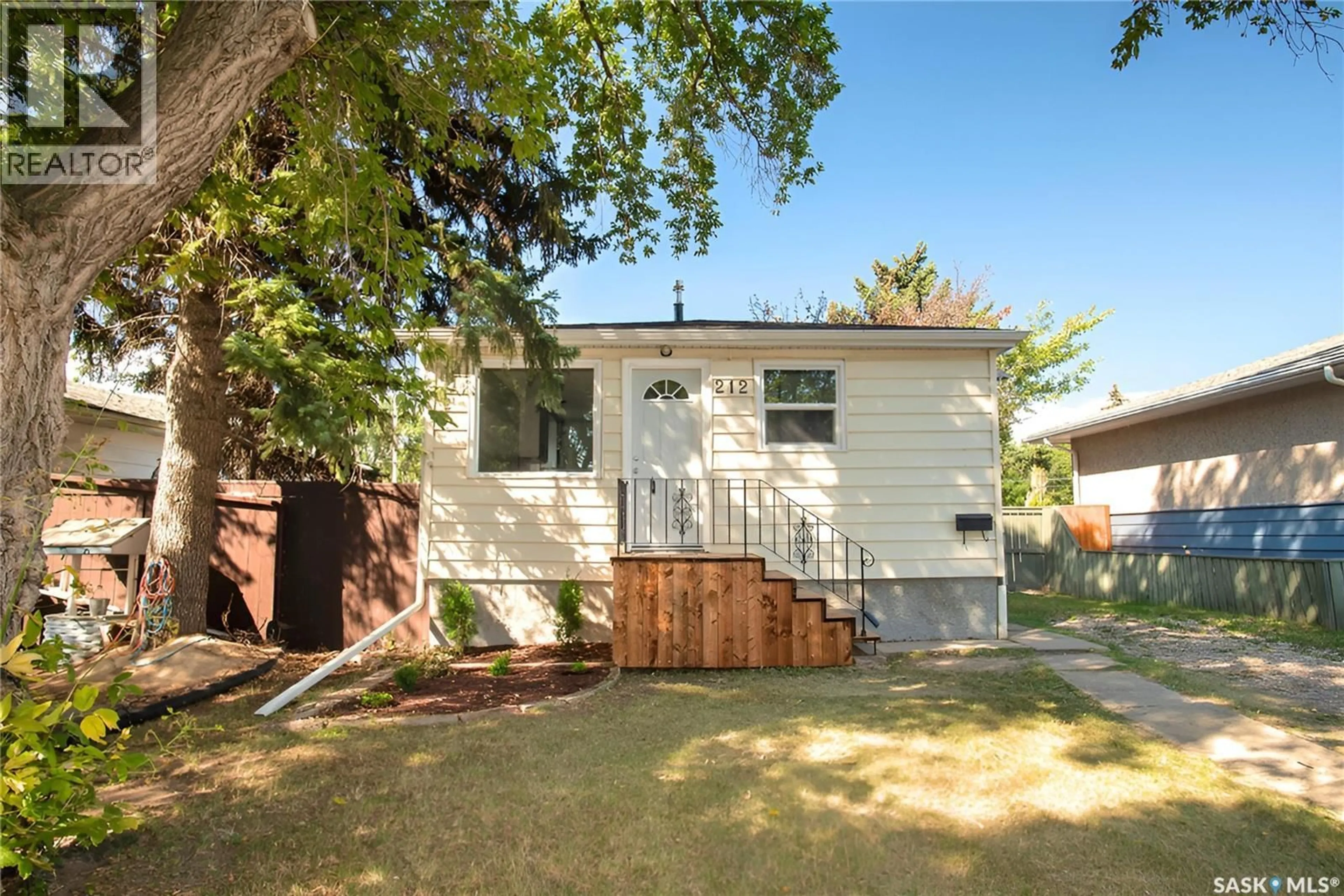 Home with vinyl exterior material, street for 212 ANGUS STREET, Regina Saskatchewan S4R3K4