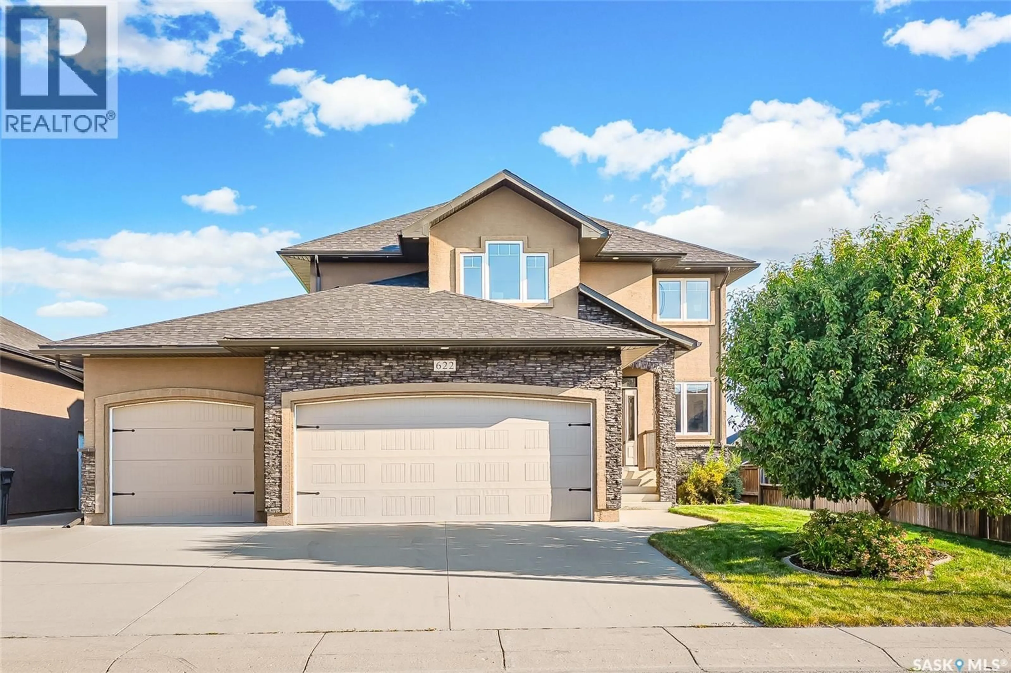 Home with brick exterior material, street for 622 THIESSEN STREET, Warman Saskatchewan S0K4S2