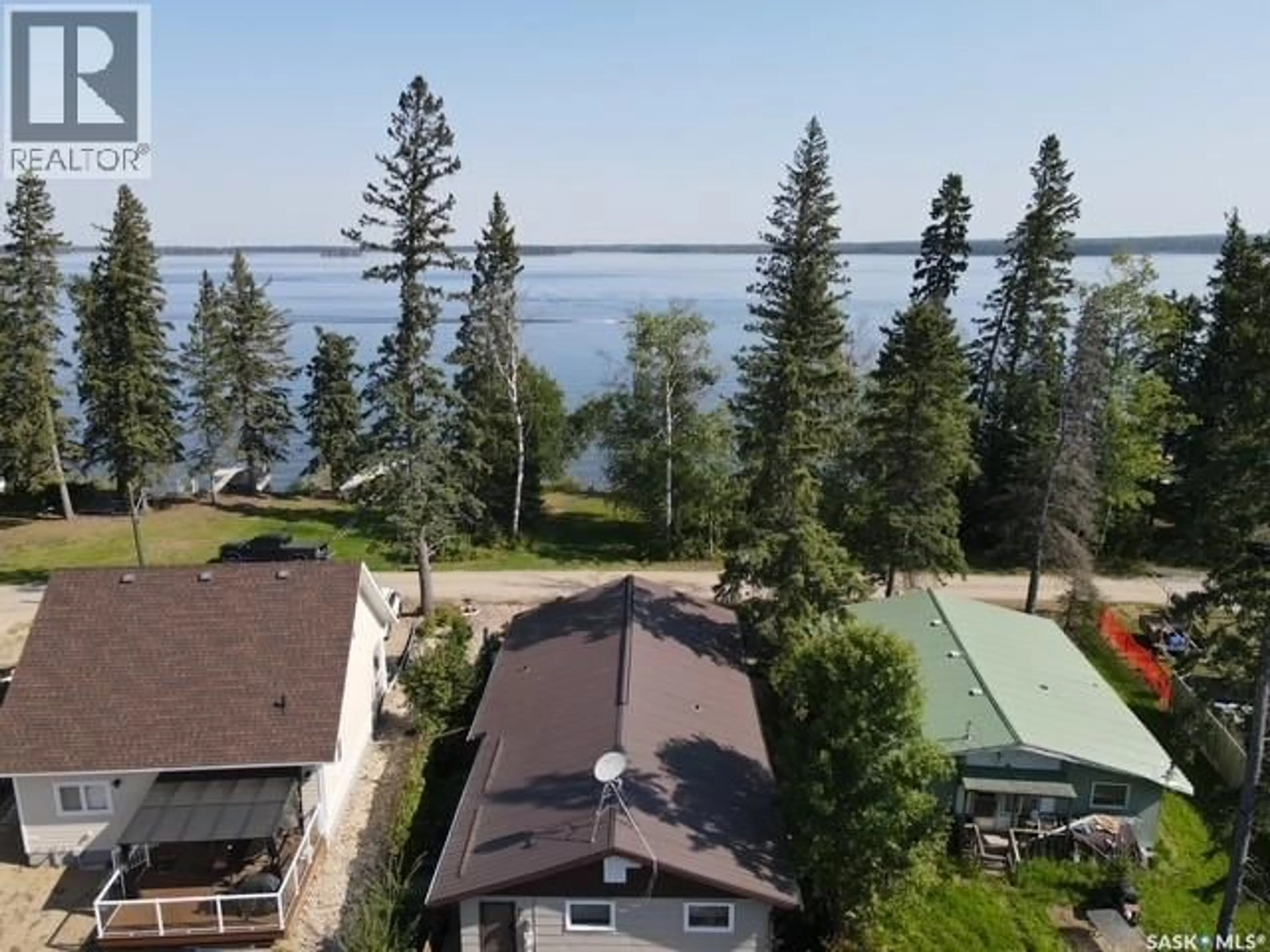 A pic from outside/outdoor area/front of a property/back of a property/a pic from drone, water/lake/river/ocean view for 815 LAKESHORE AVENUE, Duck Mountain Provincial Park Saskatchewan S0A1S0