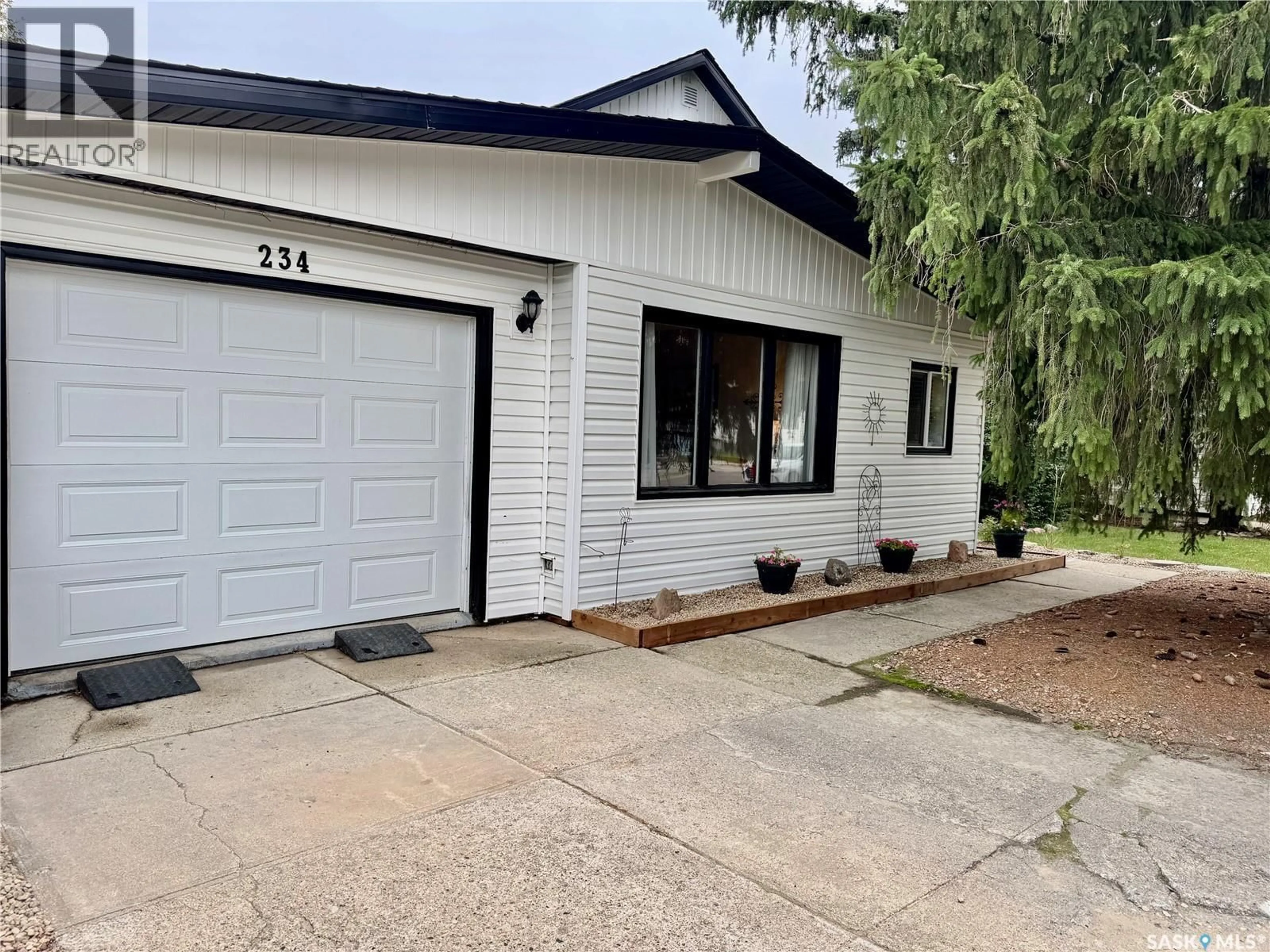 Home with vinyl exterior material, street for 234 7TH STREET, Humboldt Saskatchewan S0K2A0
