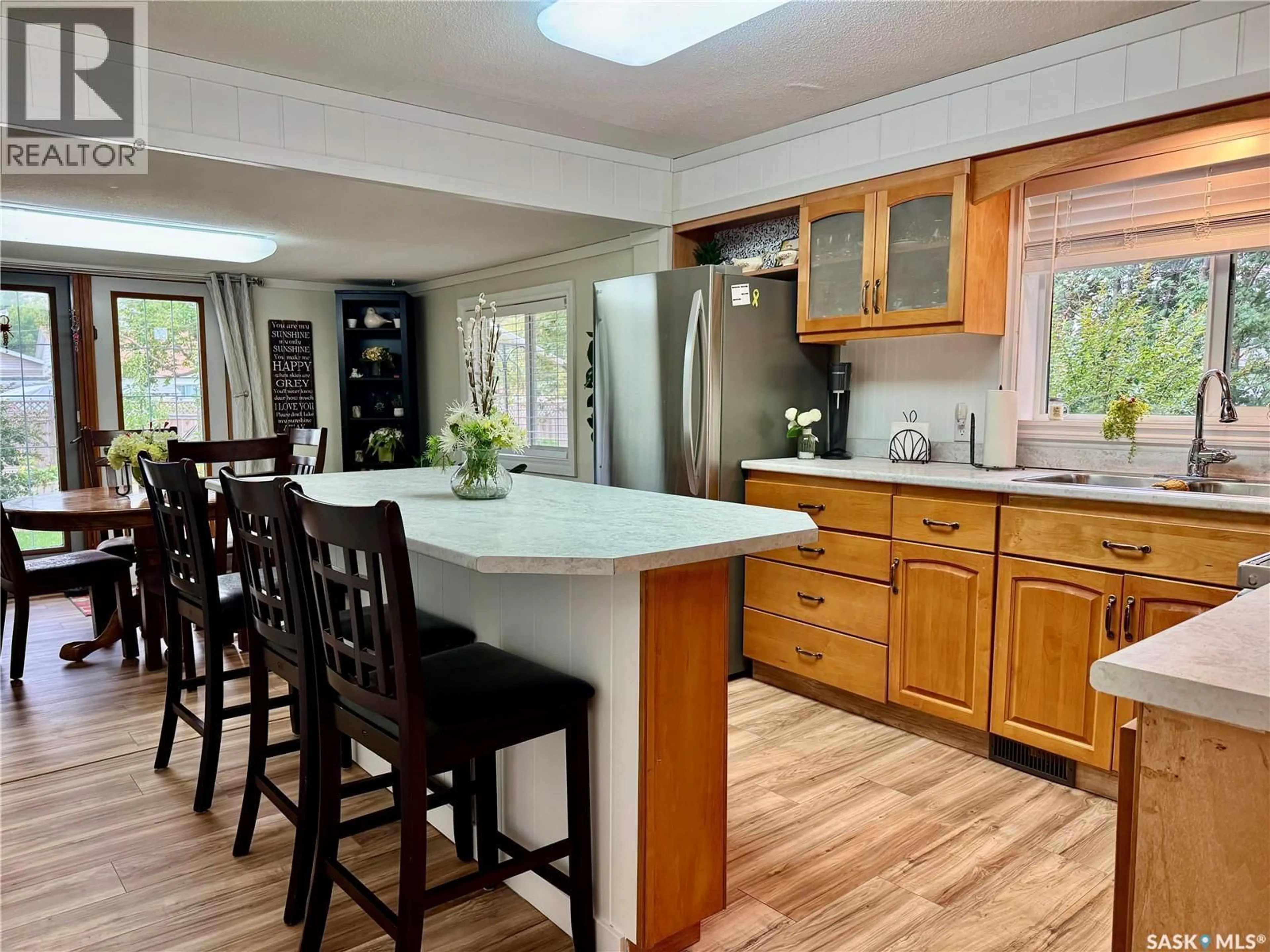 Open concept kitchen, wood/laminate floor for 234 7TH STREET, Humboldt Saskatchewan S0K2A0
