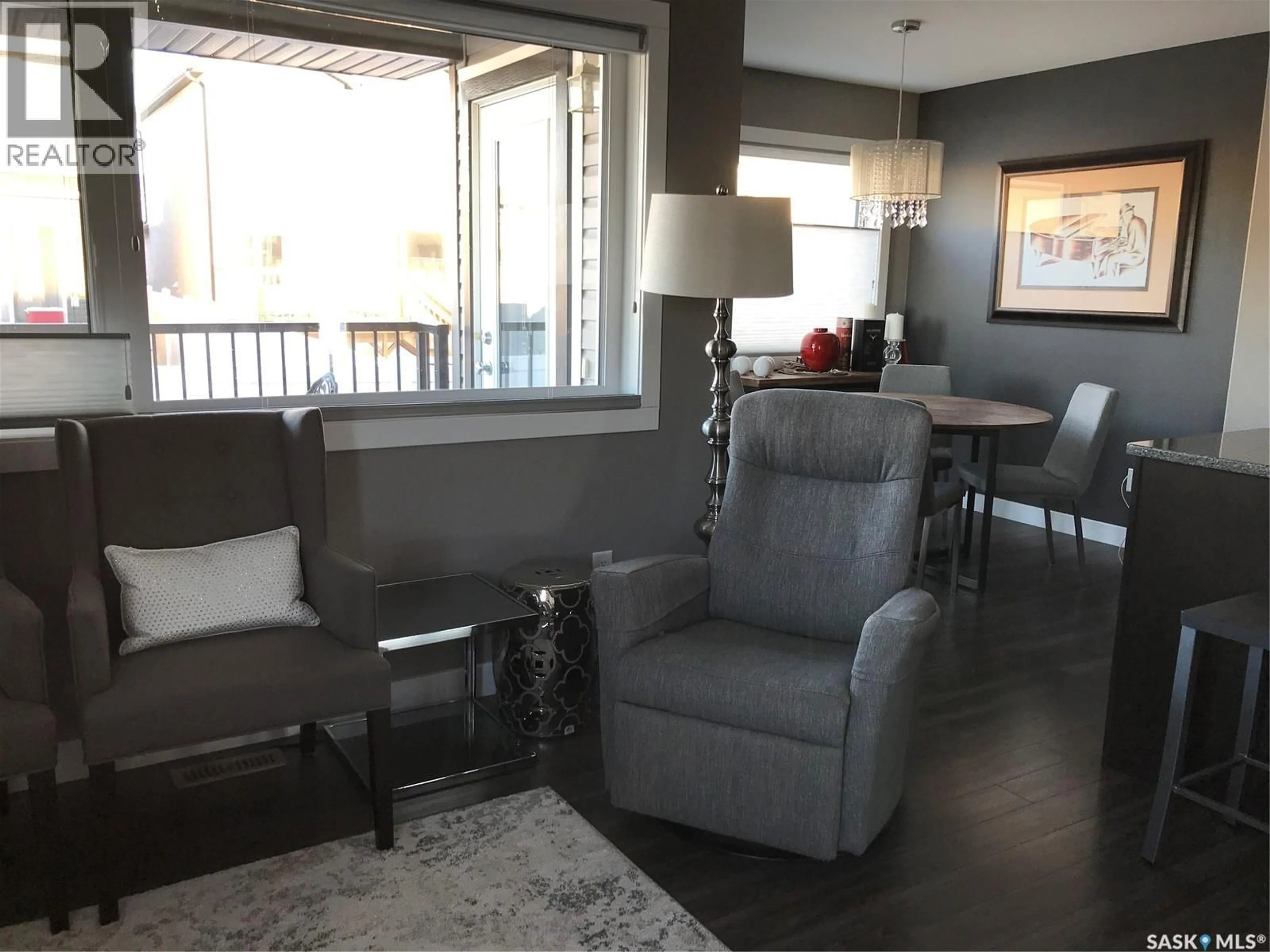 Living room with furniture, wood/laminate floor for 5301 BEACON DRIVE, Regina Saskatchewan S4W0R6