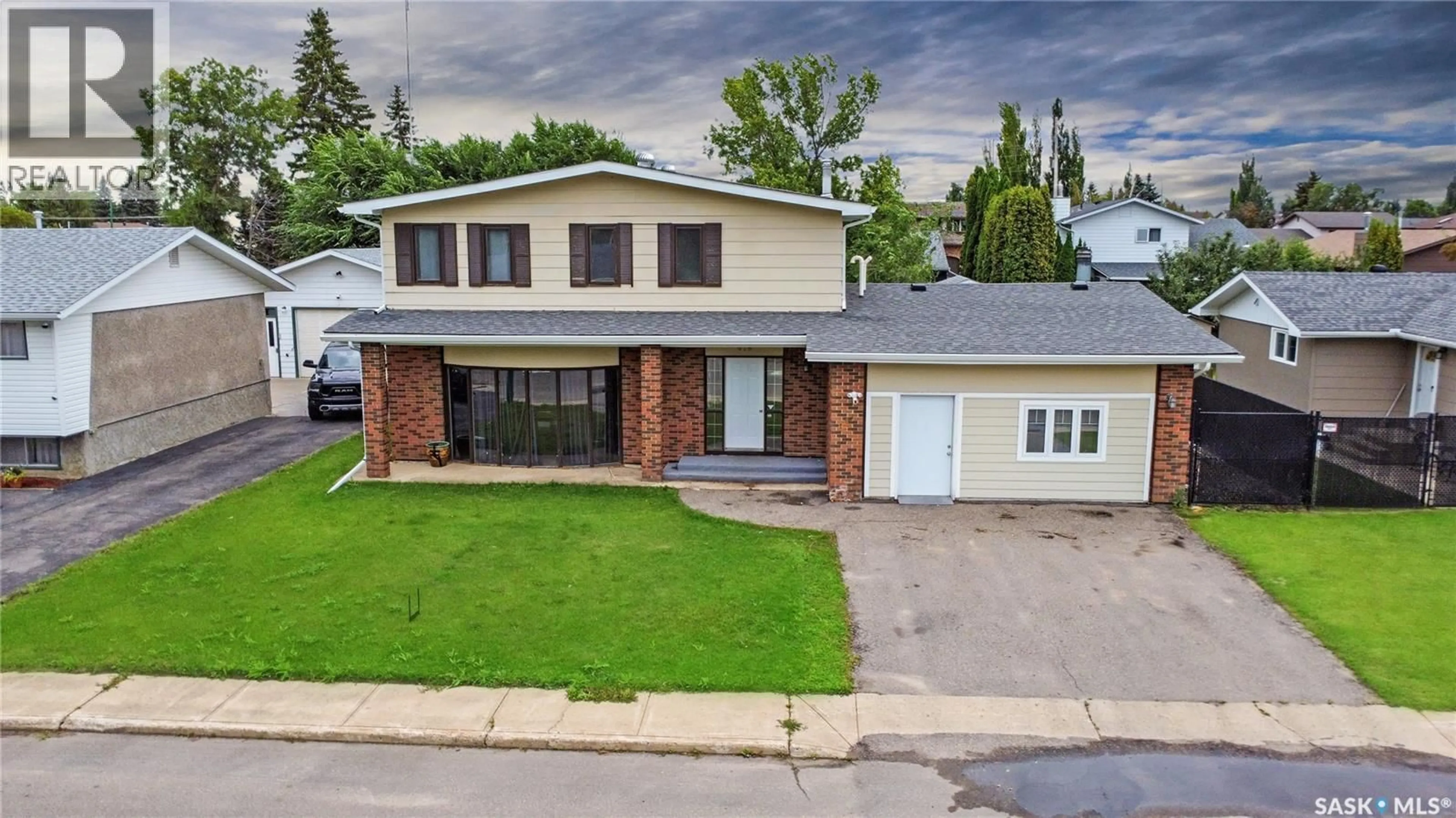 Home with brick exterior material, street for 615 BUCHANAN DRIVE, Prince Albert Saskatchewan S6V5Z7