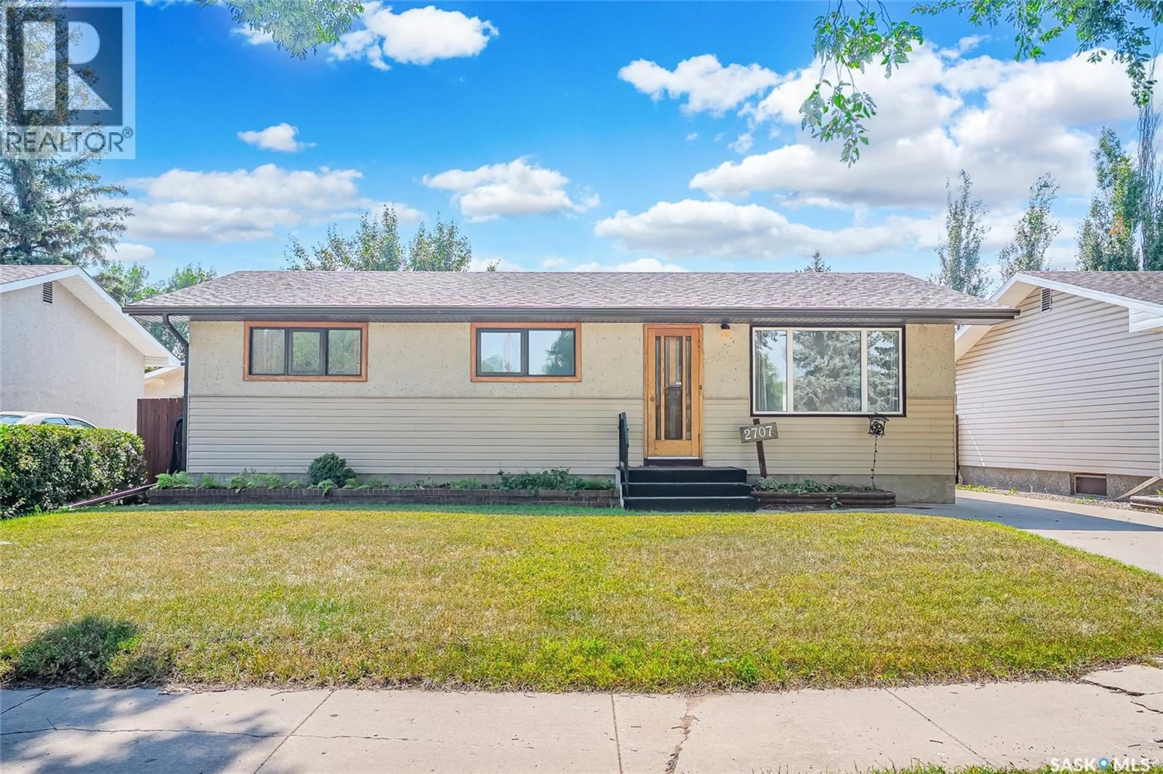 Home with vinyl exterior material, street for 2707 33RD STREET, Saskatoon Saskatchewan S7J4K7