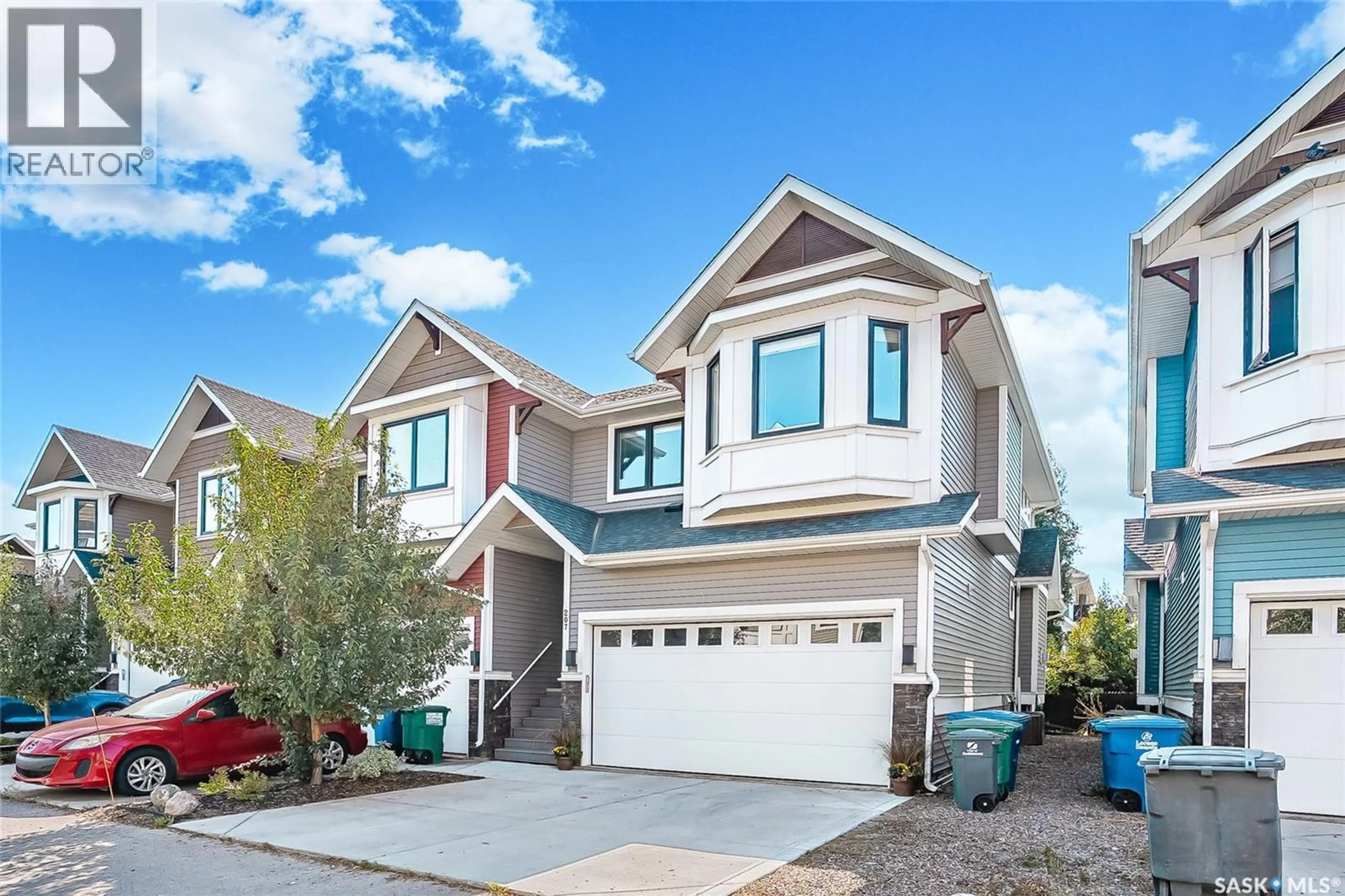 Home with vinyl exterior material, street for 207 - 3220 11TH STREET, Saskatoon Saskatchewan S7M5M4