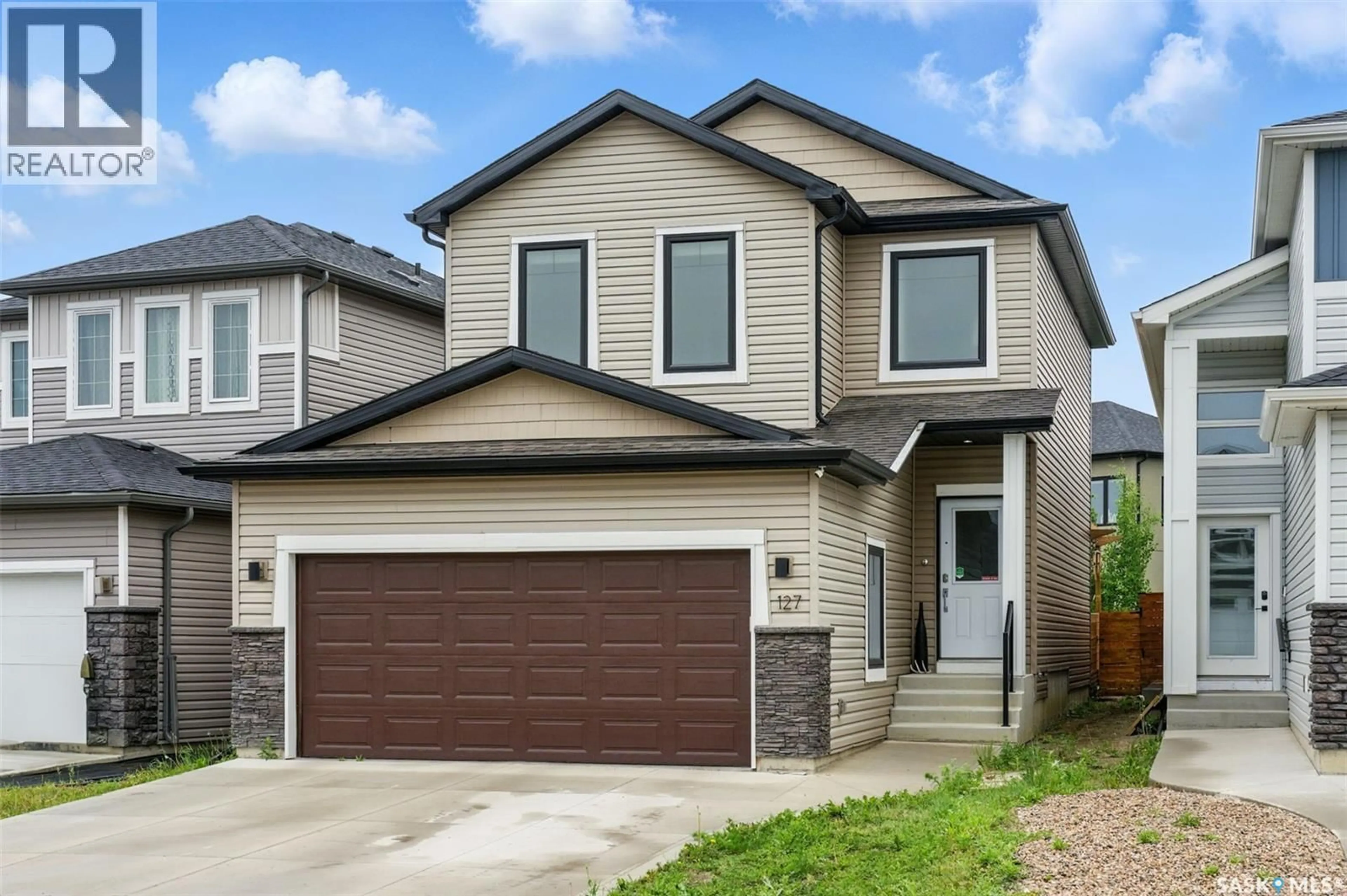 Home with vinyl exterior material, street for 127 BURGESS CRESCENT, Saskatoon Saskatchewan S7V0S1